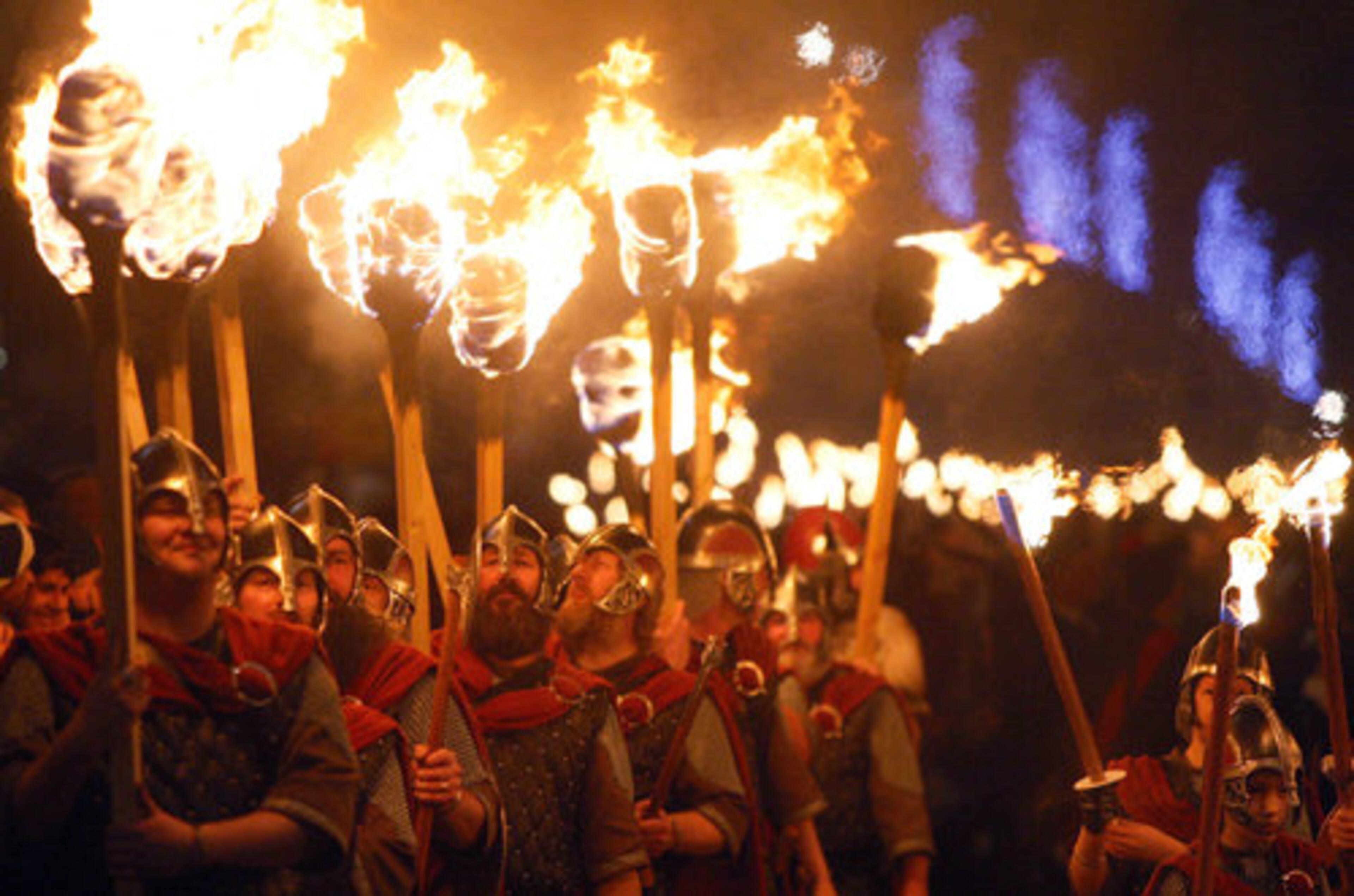 Torch carriers proceed up Edinburgh's Royal Mile to Calton Hill launching the start of Edinburgh's Hogmanay (New Year) celebrations in Edinburgh, Scotland. Hogmanay is the traditional year end celebration with many of the participants dressed in Viking costume for the various street parades and public festivities.