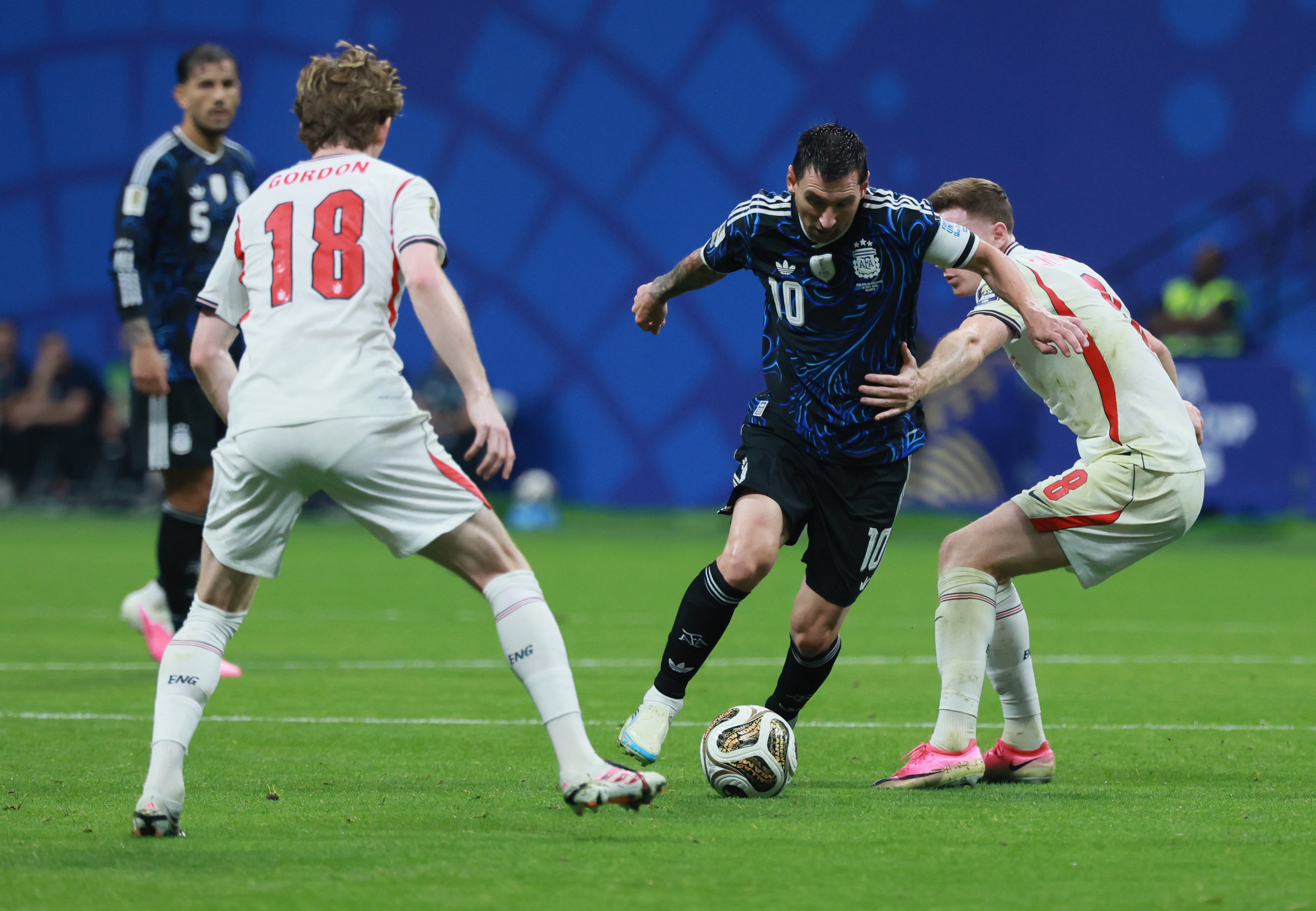 Argentina's Lionel Messi controls ball between England's Anthony Gordon, left and England's Elliot Anderson during first half of Argentina vs. England FIFA World Cup Semifinal match at Atlanta Stadium (Mercedes-Benz Stadium) on Wednesday, July 15, 2026. (Jason Getz/AJC)