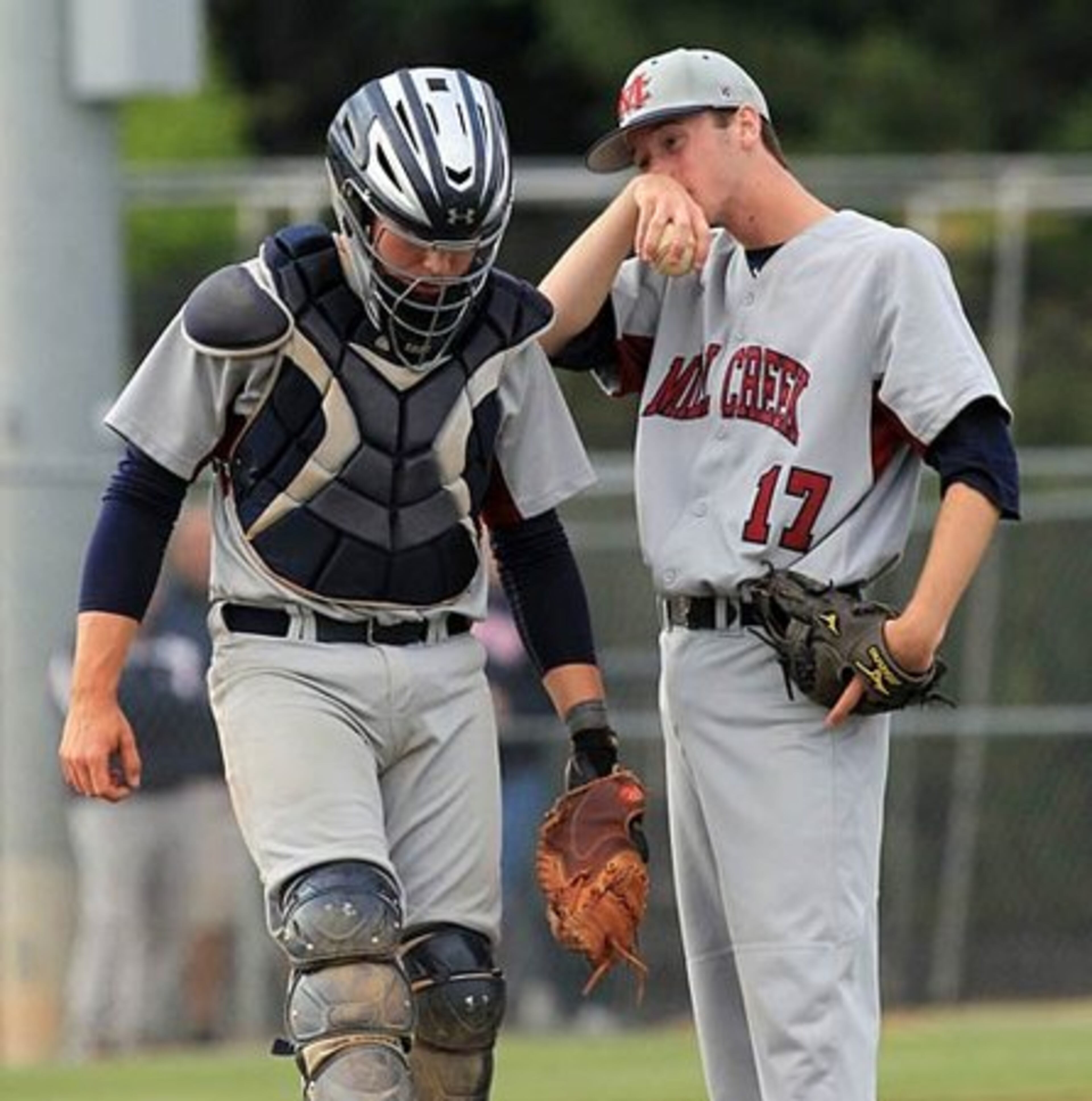 After pitching 4 shutout innings against Hillgrove, Mill Creek pitcher Cody Pugh and catcher Jerad Curry react to giving up 5 runs to Hillgrove during 5th inning action.