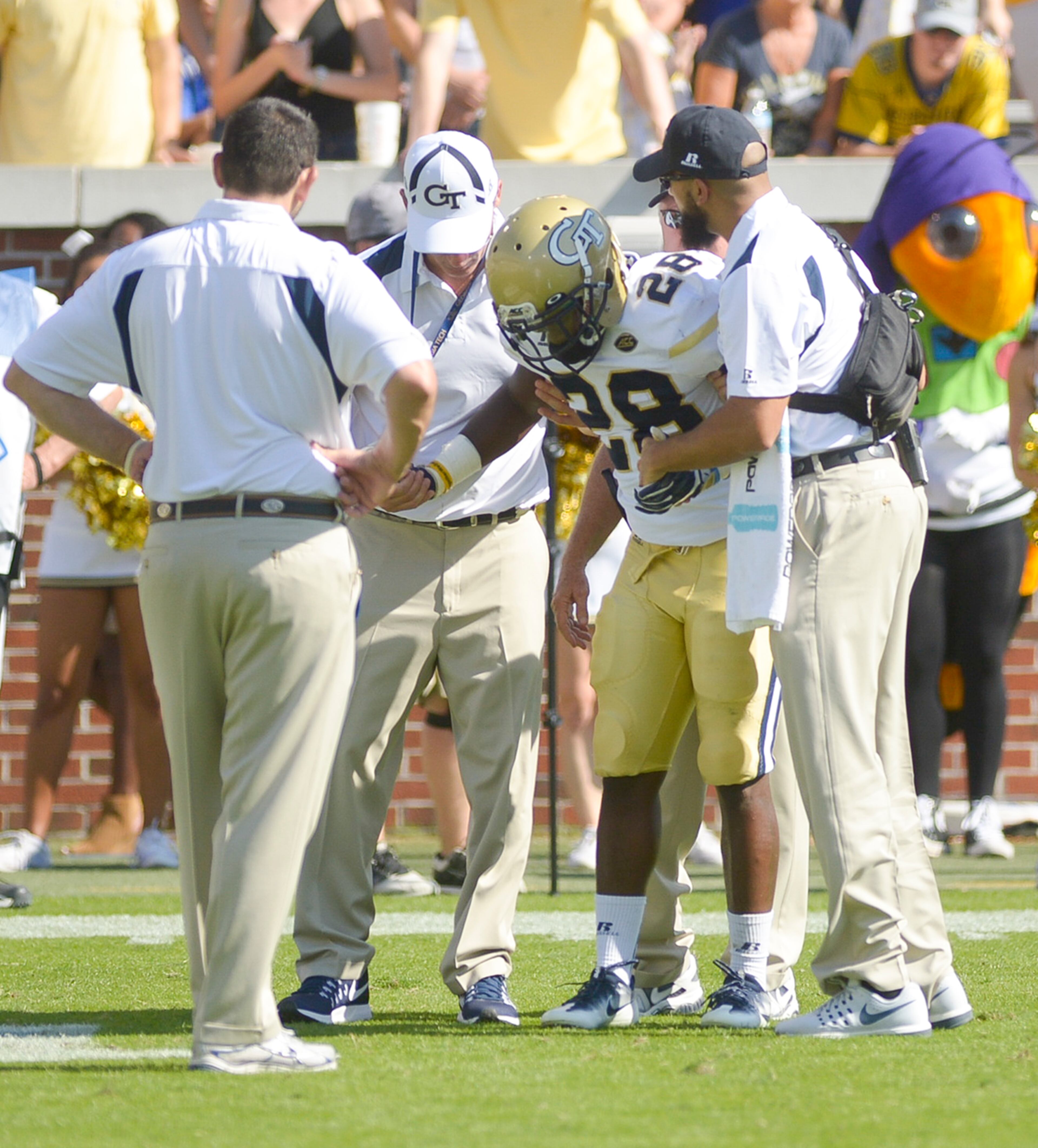 Junior AB J.J. Green (28) is helped off the field by trainers after being injured during a play in the second half the Yellow Jackets' game against the Duke Blue Devils Saturday, October 29, 2016. SPECIAL/Daniel Varnado