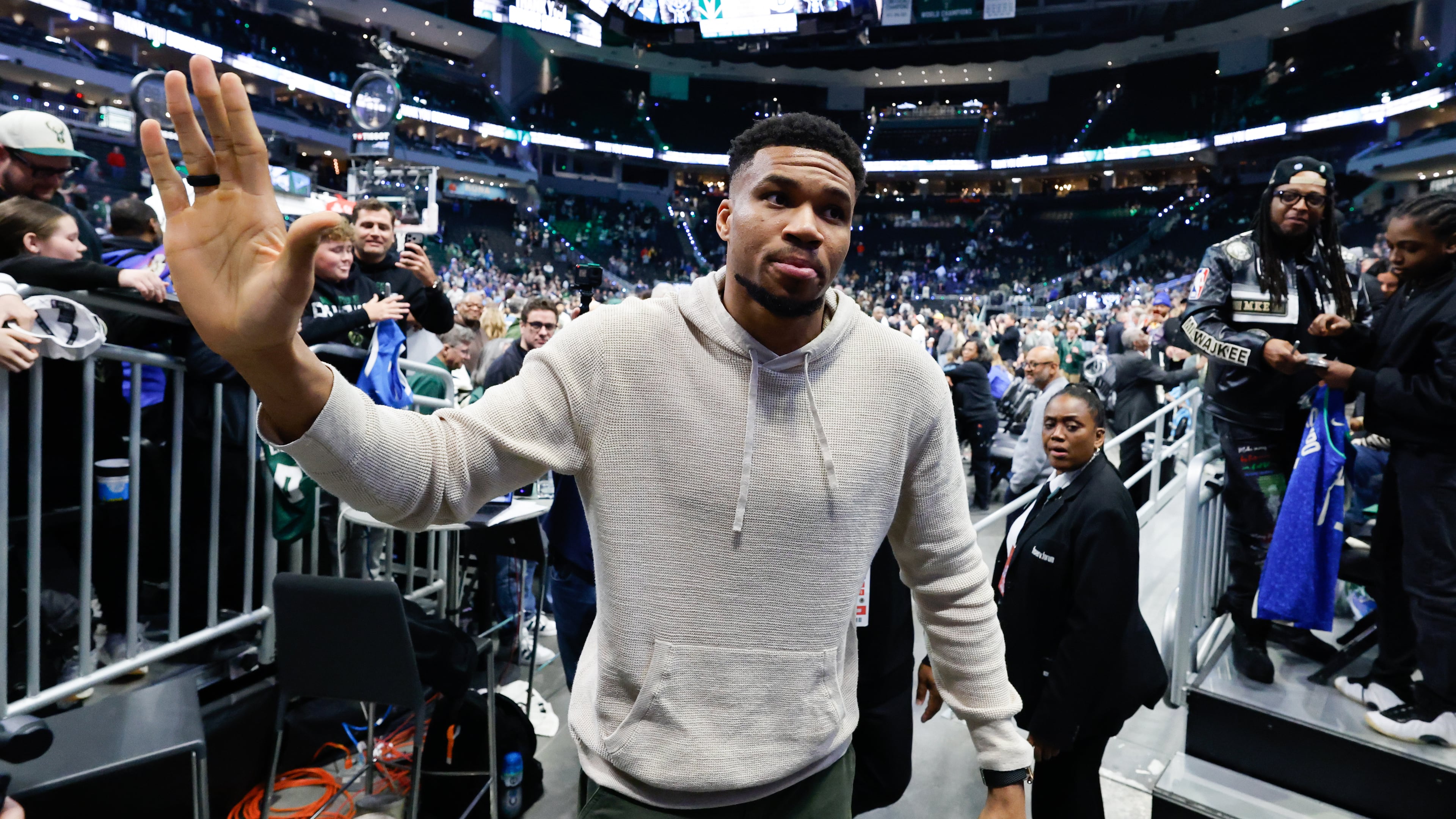 Milwaukee Bucks forward Giannis Antetokounmpo, center, walks off the court after an NBA basketball game against the Brooklyn Nets, Friday, April 10, 2026, in Milwaukee. (AP Photo/Jeffrey Phelps)