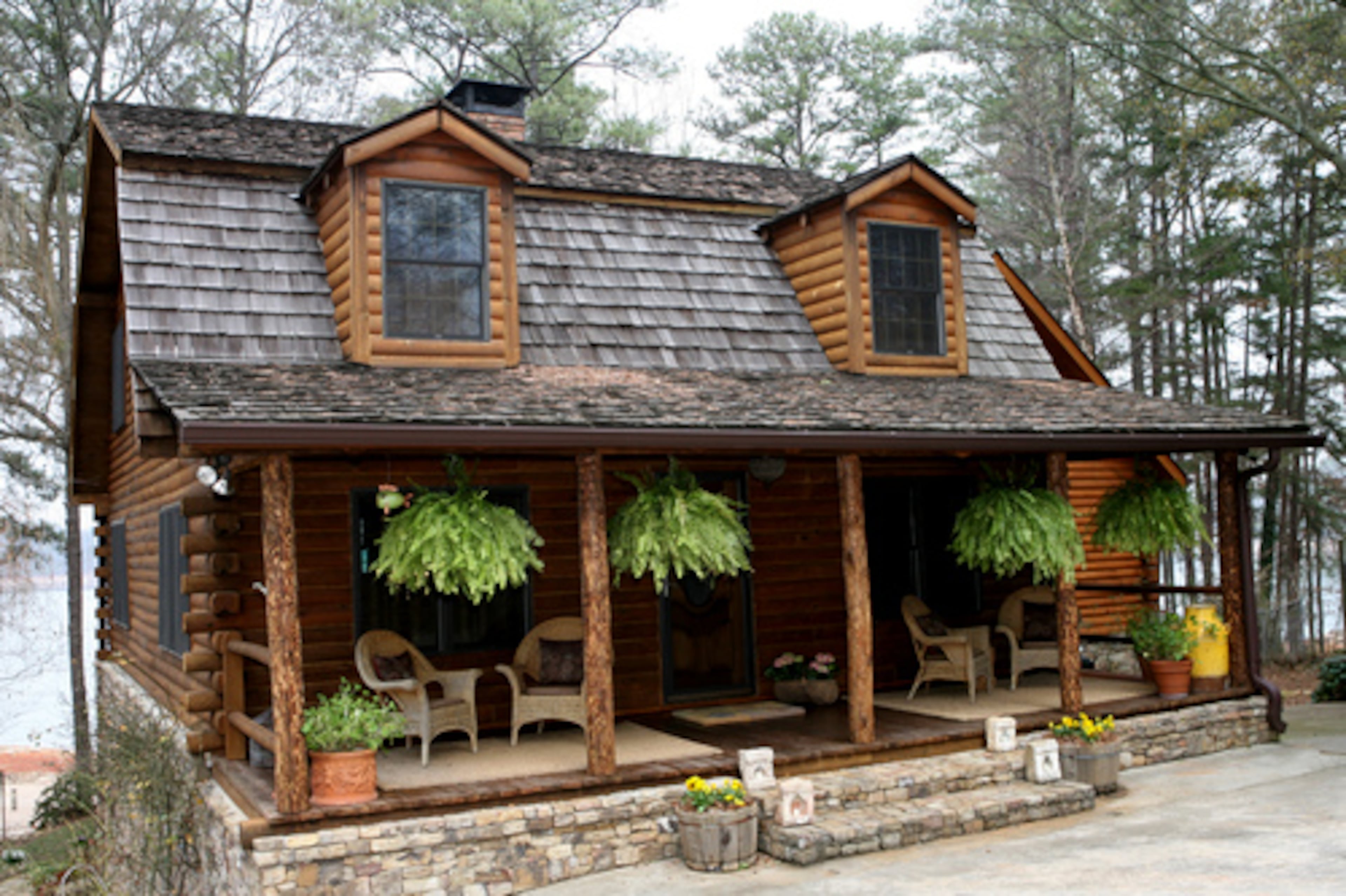 The front view of the Linda and Ron Silber's cabin makes the house look deceptively small. The original cabin was built by the late W.J. Dodd, a former Gwinnett County sheriff and commissioner, in 1986.