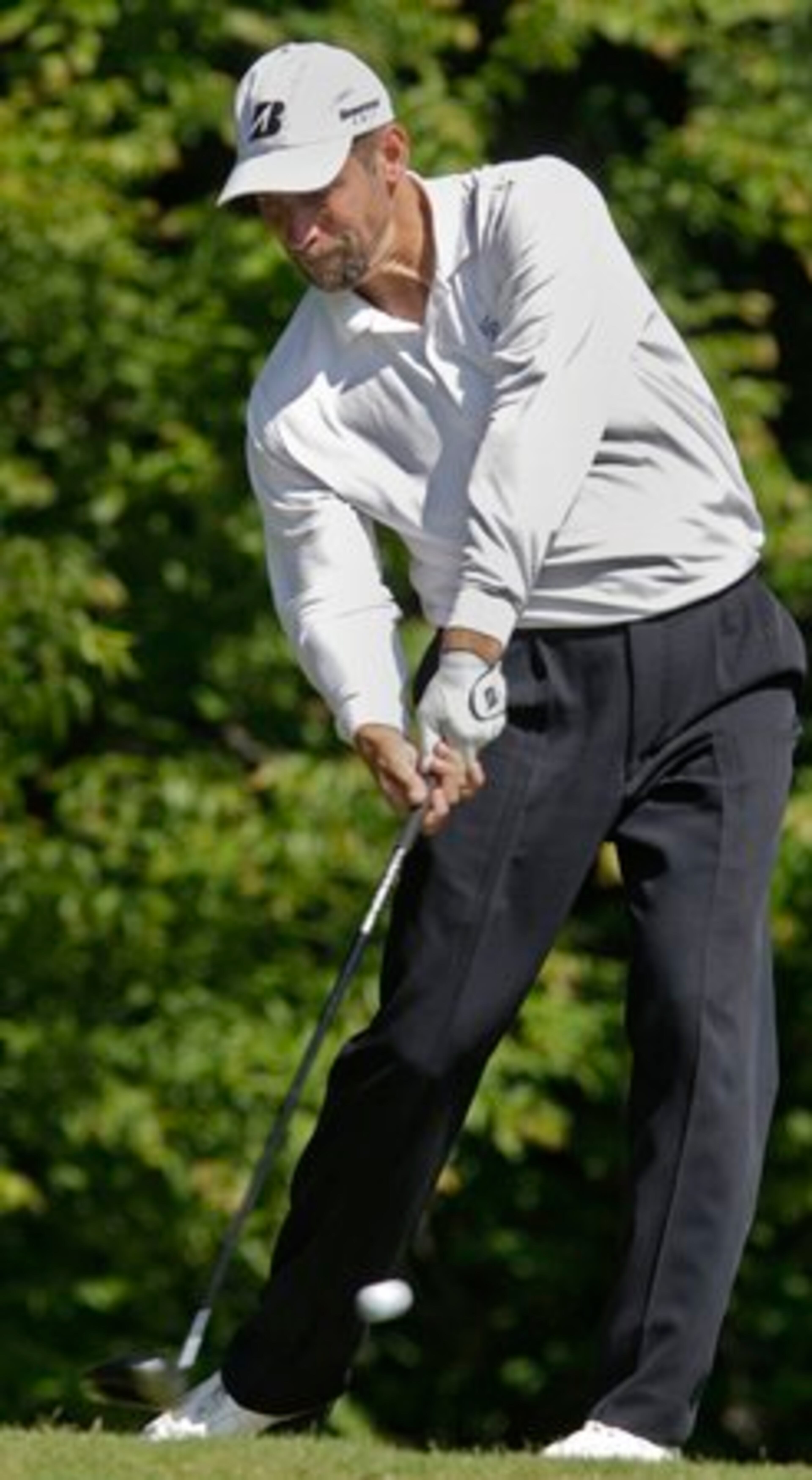 John Smotz hits his tee shot on the 18th hole. John Smoltz was among those trying to qualify for the U.S. Open in a qualifying tournament in Suwanee today. Tuesday May 17, 2011
