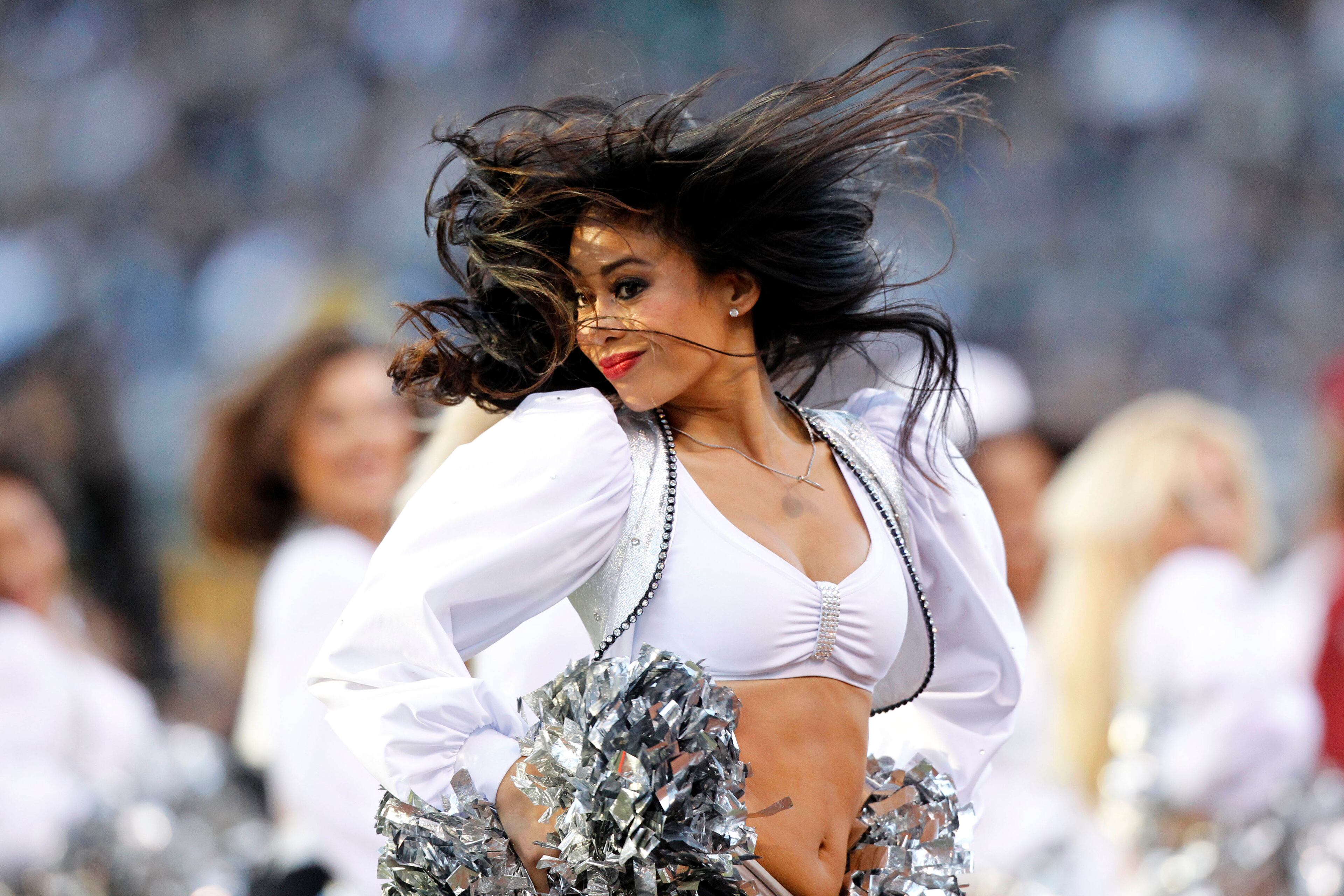 An Oakland Raiders cheerleader from the raiderettes performs during a timeout against the Tennessee Titans in the fourth quarter at O.co Coliseum. The Titans defeated the Raiders 23-19. Mandatory Credit: Cary Edmondson-USA TODAY Sports