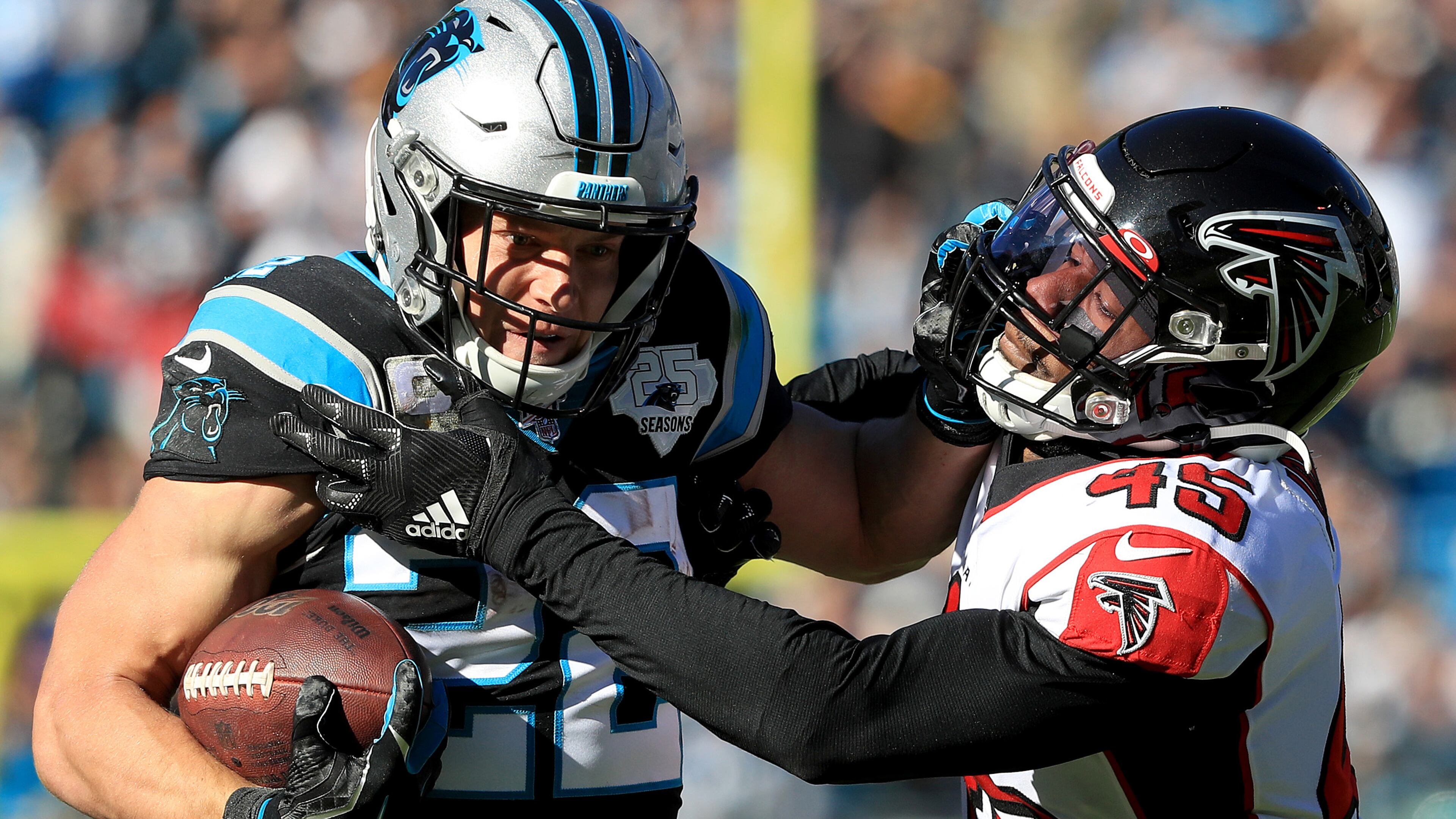 Falcons linebacker Deion Jones tries to stop Panthers running back Christian McCaffrey Sunday, Nov. 19, 2019, at Bank of America Stadium in Charlotte.