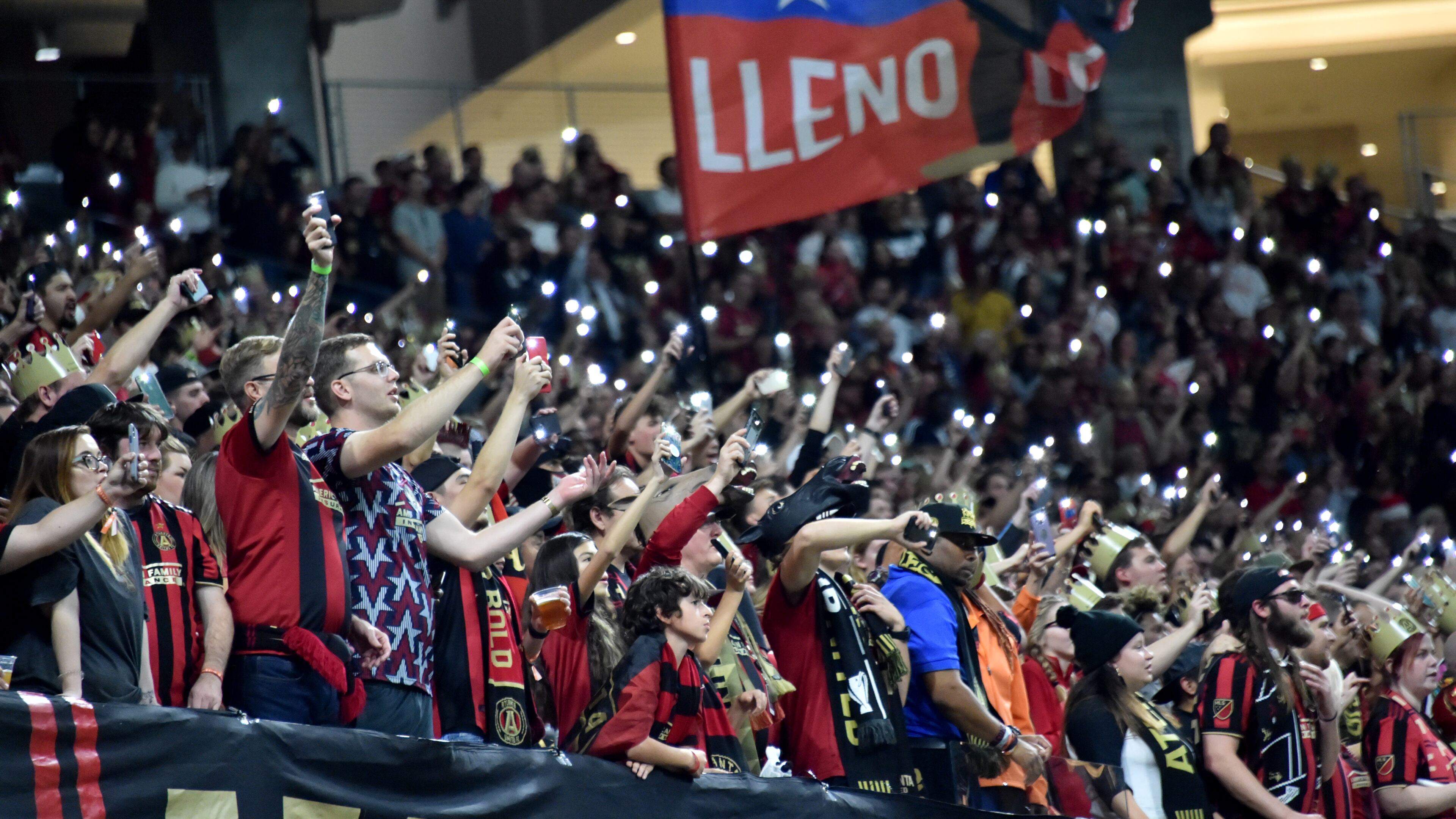 October 24, 2019 Atlanta - Atlanta United fans cheer for their team as they hold lights in the second half during Eastern Conference semifinals of MLS playoffs at Mercedes-Benz Stadium on Thursday, October 24, 2019. Atlanta United won 2-0 over the Philadelphia Union. (Hyosub Shin / Hyosub.Shin@ajc.com)