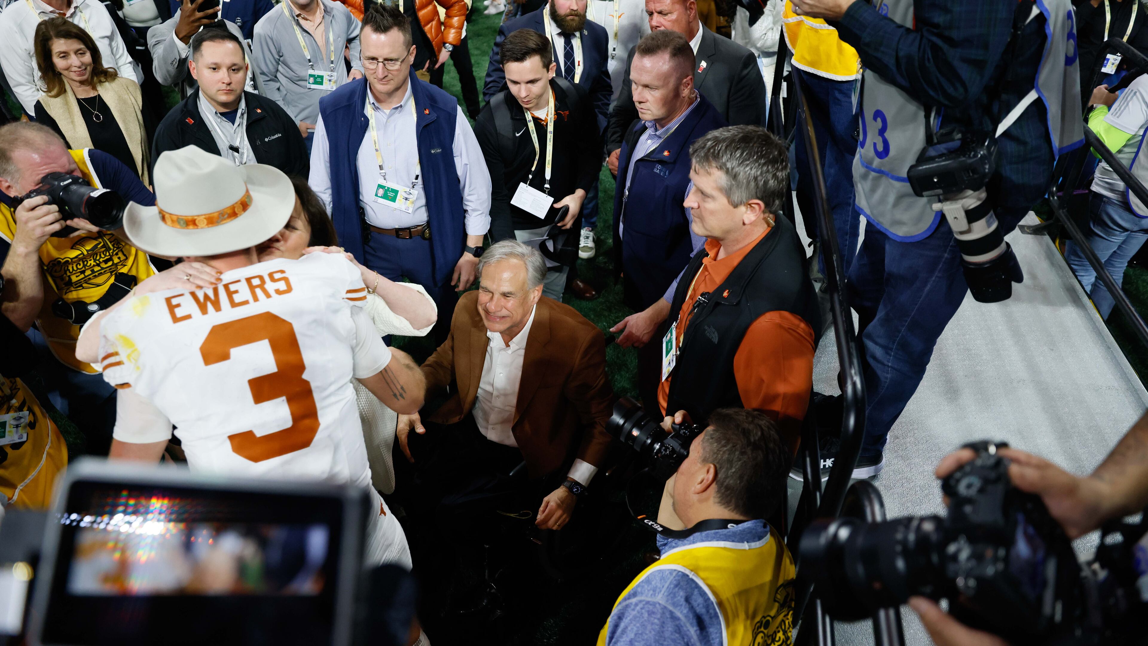 Texas Longhorns quarterback Quinn Ewers (3) gets congratulated as Texas Governor Greg Abbott smiles as the Texas Longhorns beat the Arizona State Sun Devils 39-31 in double overtime at the Chick-fil-A Peach Bowl held at Mercedes-Benz Stadium on Wednesday, January 1, 2025, in Atlanta.
(Miguel Martinez / AJC)