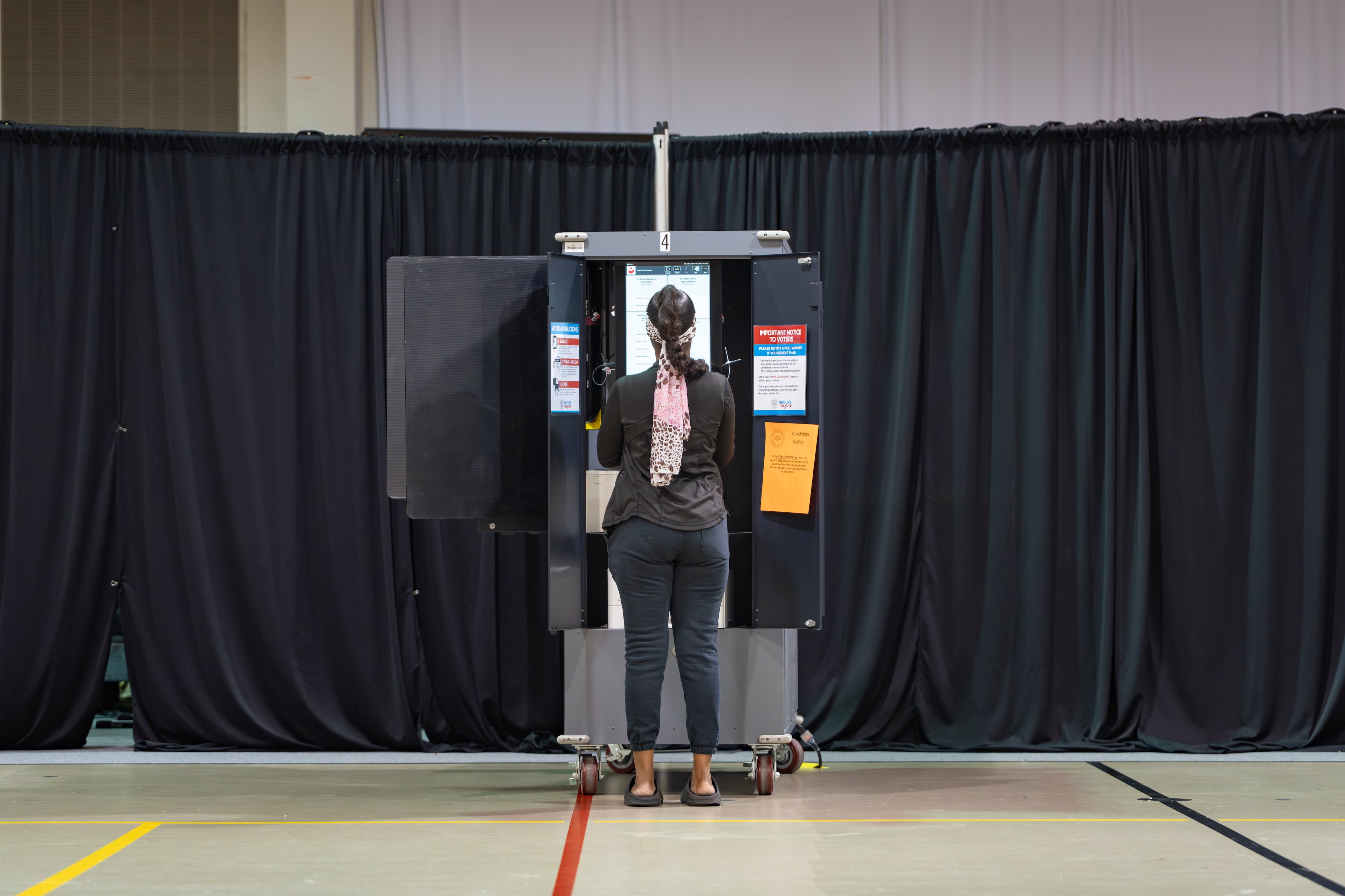 A woman votes at the Calvary Baptist Church polling location in Austell back in May. (Ben Hendren for the AJC)
