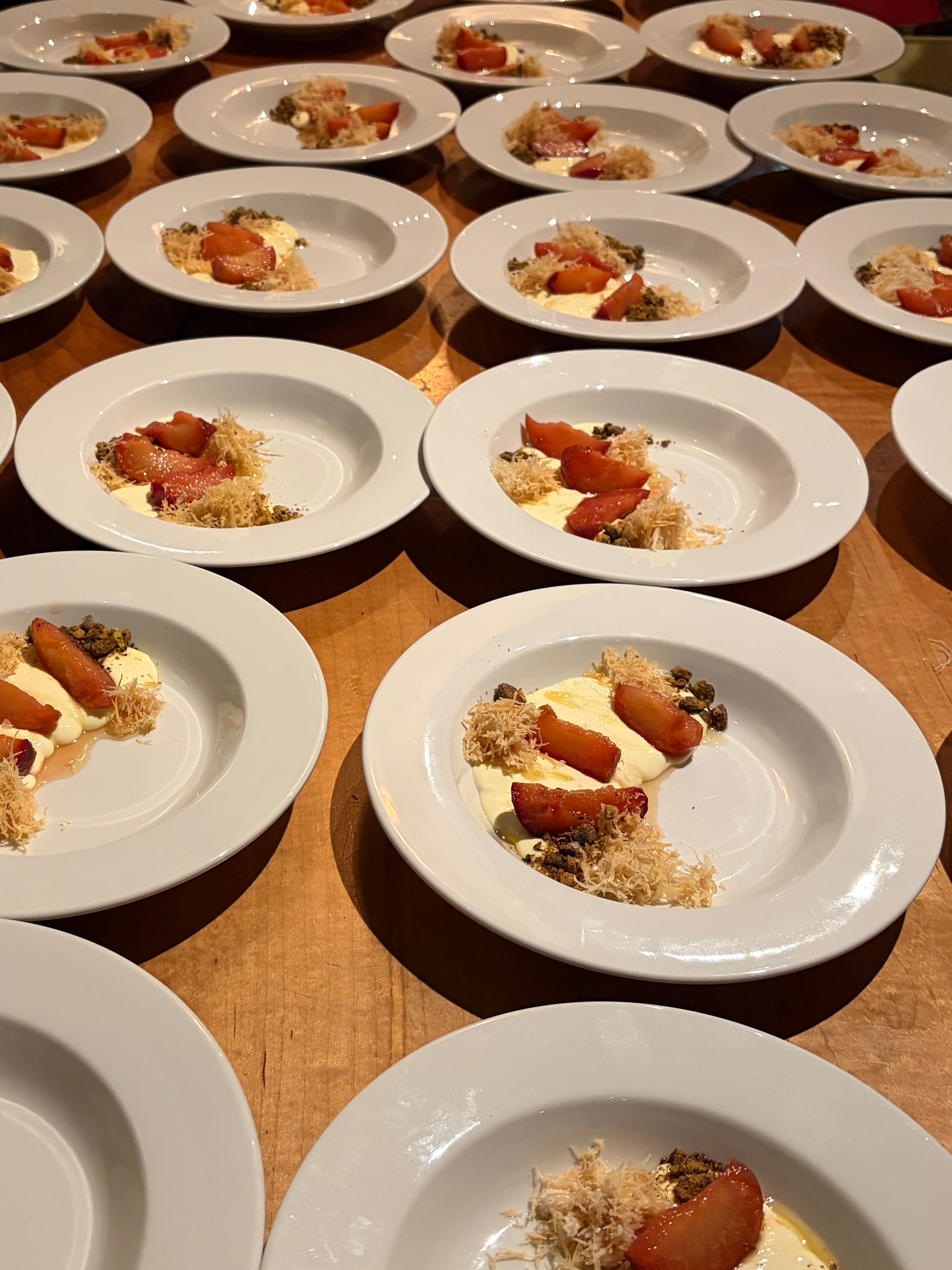 Plates of whipped brie with poached plums and phyllo crisp made by Charmain Ware-Jason. (Lia Picard for the AJC)