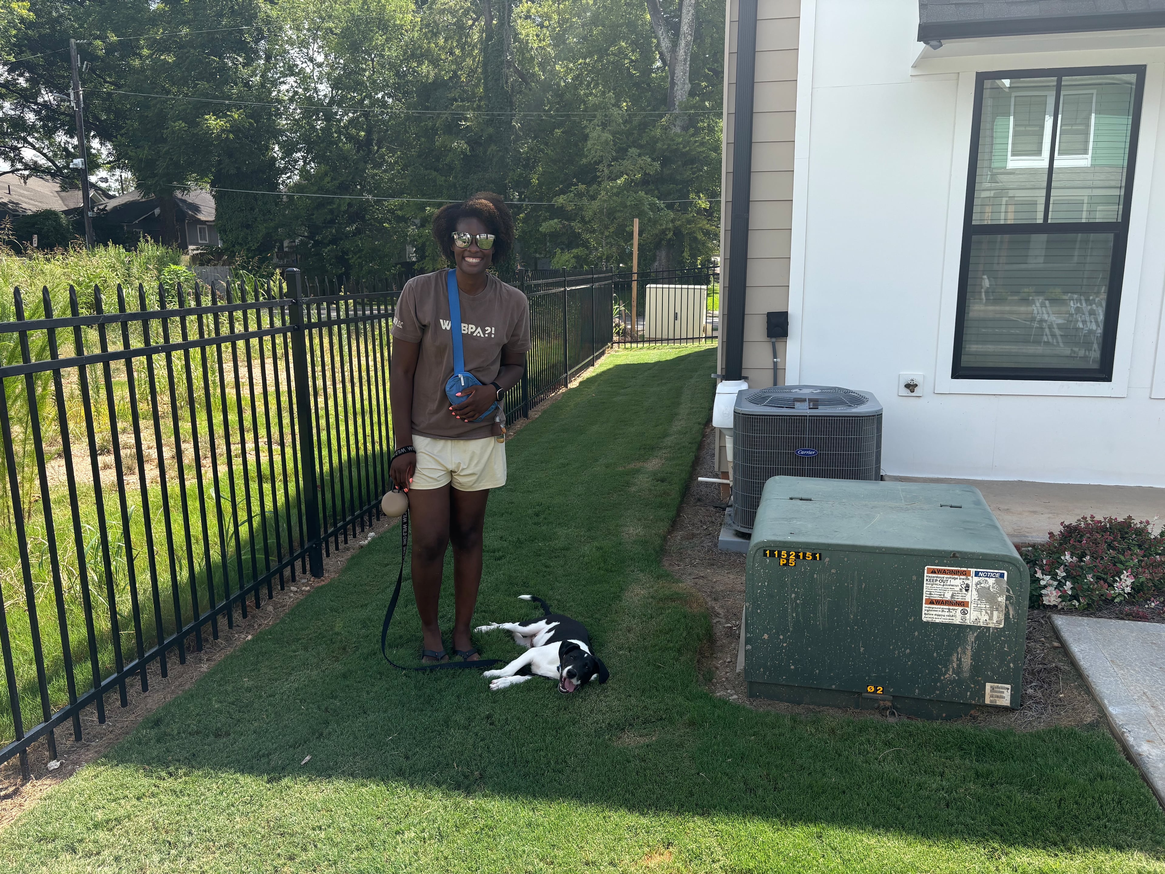 Public school teacher Nicole Baugh purchased her first home, in Atlanta's Oakland City neighborhood, last year. Its proximity to the Beltline makes it easier for the fourth grade teacher to take her puppy, Pedro, on walks. (Shaddi Abusaid/AJC)