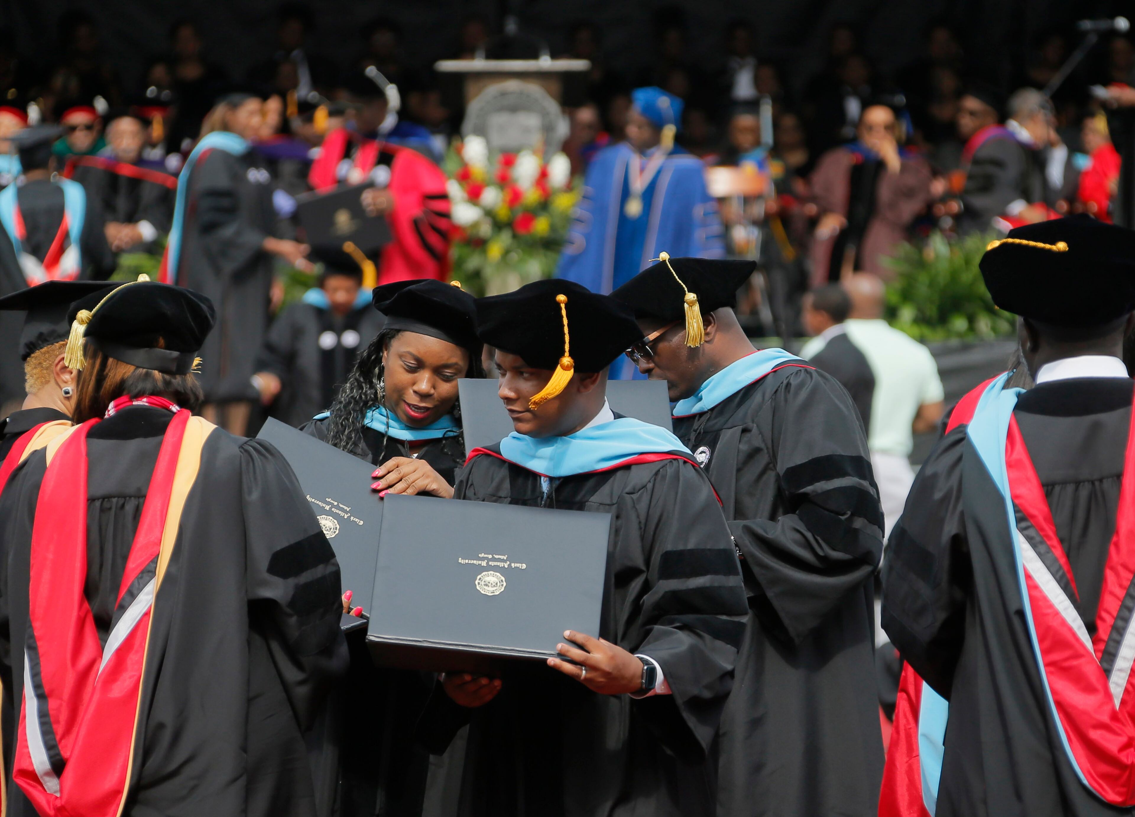 5/22/17 - Atlanta - Doctoral graduates were the first to receive their diplomas. Clark Atlanta University's Panther Stadium was the site of their 28th annual Commencement. Businessman William Pickard gave the commencement address. Rev. Jesse Jackson, who received an honorary degree, also spoke. Panther Stadium, BOB ANDRES /BANDRES@AJC.COM