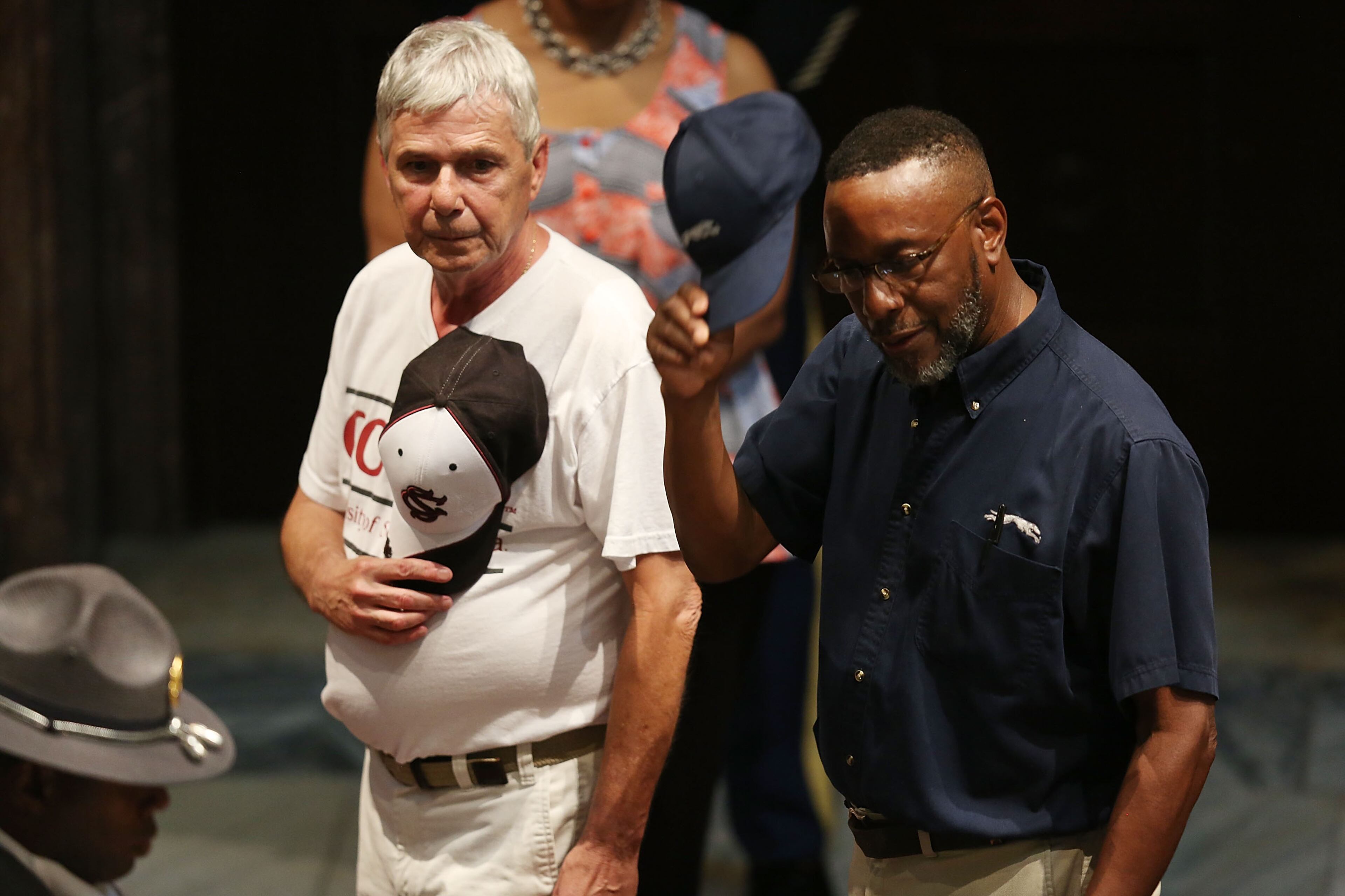 People file past the open casket of church pastor and South Carolina State Sen. Clementa Pinckney who will lie in repose at the Statehouse Rotunda on June 24, 2015 in Columbia, South Carolina. Pinckney was one of nine people killed during a Bible study inside Emanuel AME church in Charleston. U.S. President Barack Obama and Vice President Joe Biden are expected to attend the funeral which is set for Friday June 26 at the TD Arena. (Photo by Joe Raedle/Getty Images)