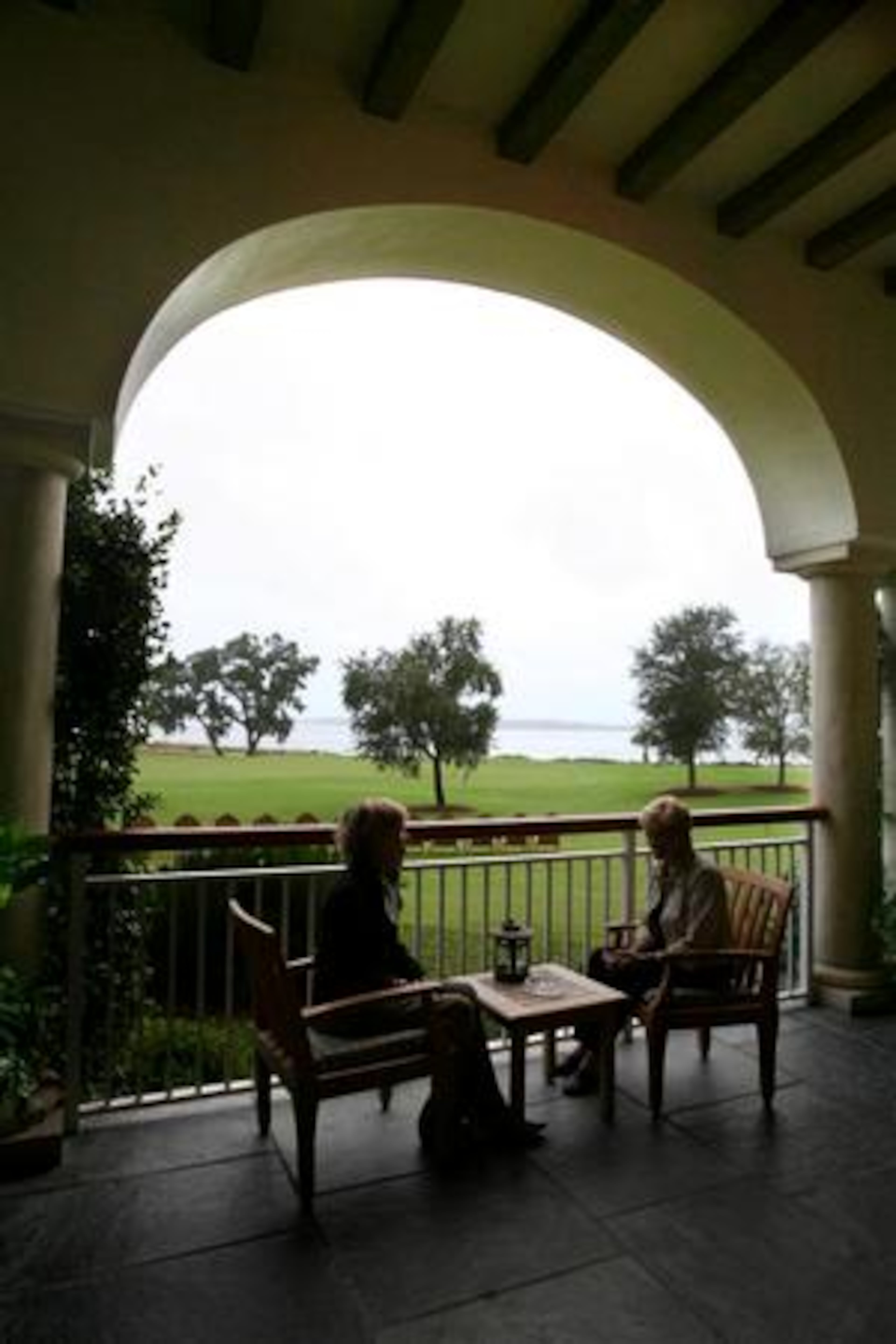 Marcia Meeks (left), of Evansville, Indiana, and friend Joan Keck, also of Evansville, sit and chat on the terrace at the the Lodge at sunset before heading to dinner with the rest of their group. The women were visiting The Lodge on a "girls trip".