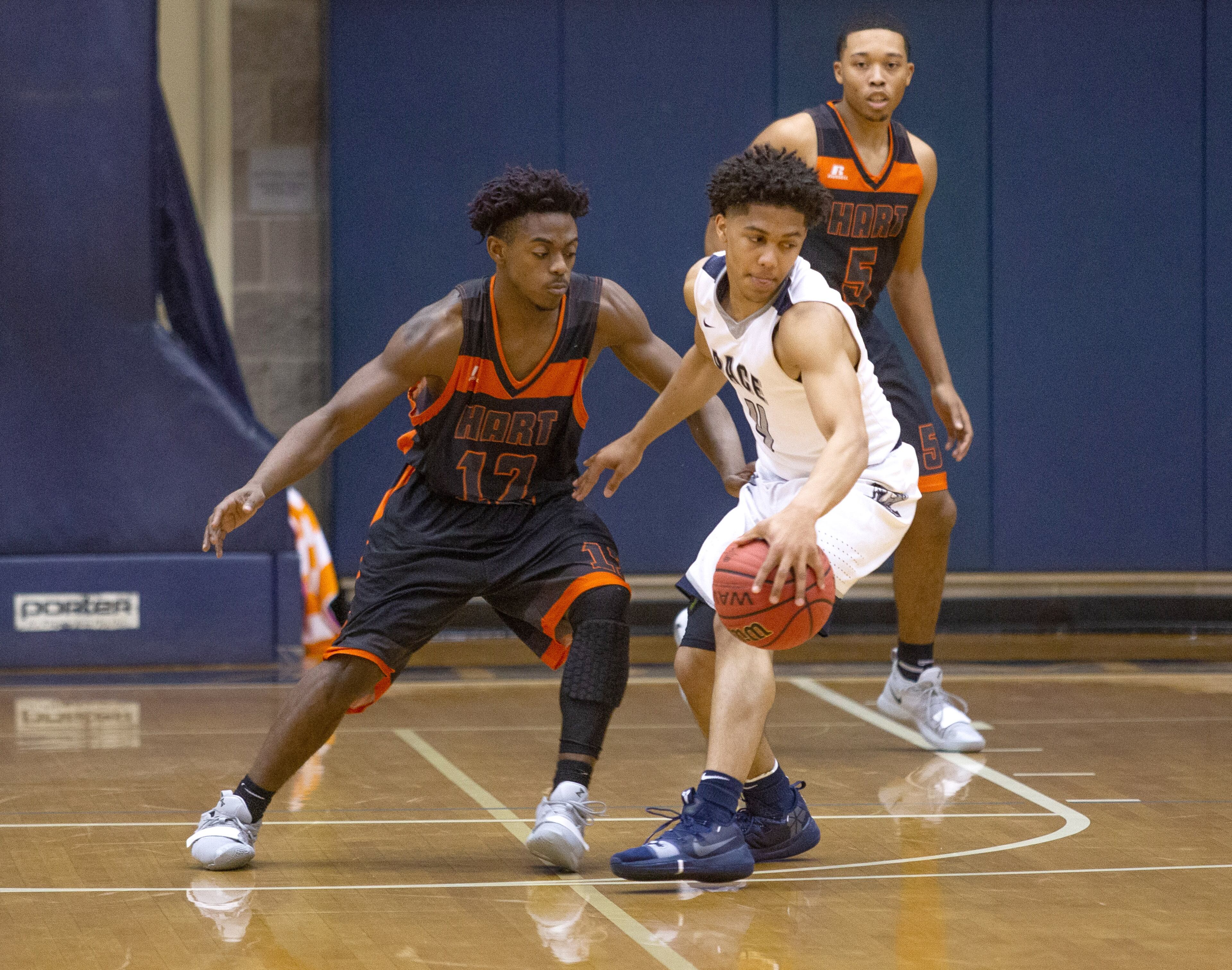 Pace Academy High School player Reign Watkins tries to take the ball up court while being guarded by Hart County High School's Justin Johnson during the first round of the state basketball tournament at Pace Academy high school Saturday, February 16, 2019. STEVE SCHAEFER / SPECIAL TO THE AJC