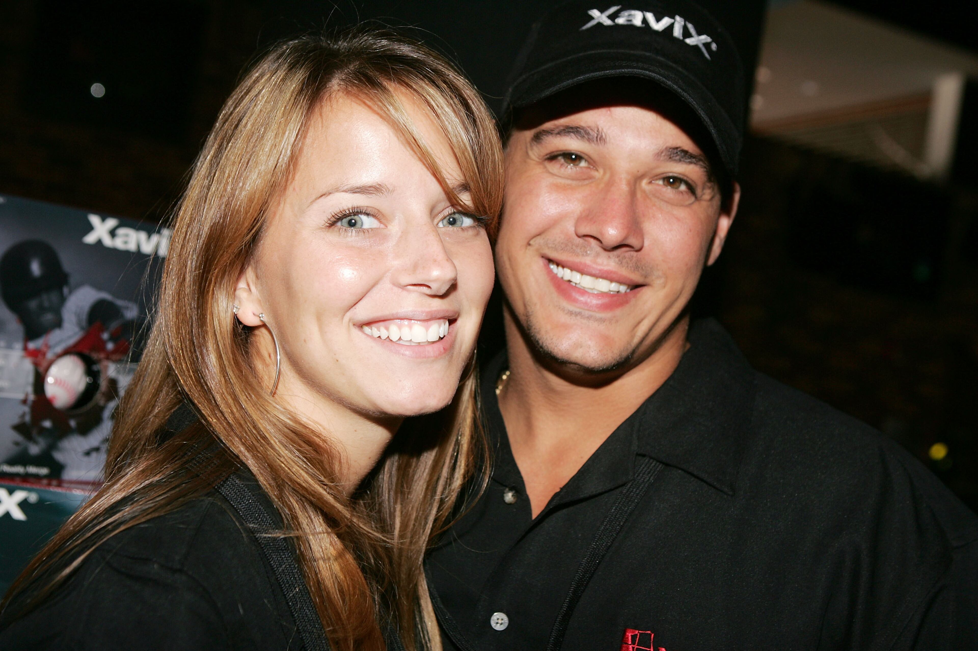 NEW YORK - AUGUST 4: Reality stars Rob Mariano and Amber Brkich of Survivor pose for a photo during the launch of XaviX Video Games at the ESPN Zone August 4, 2004 in New York City. (Photo by Scott Gries/Getty Images)