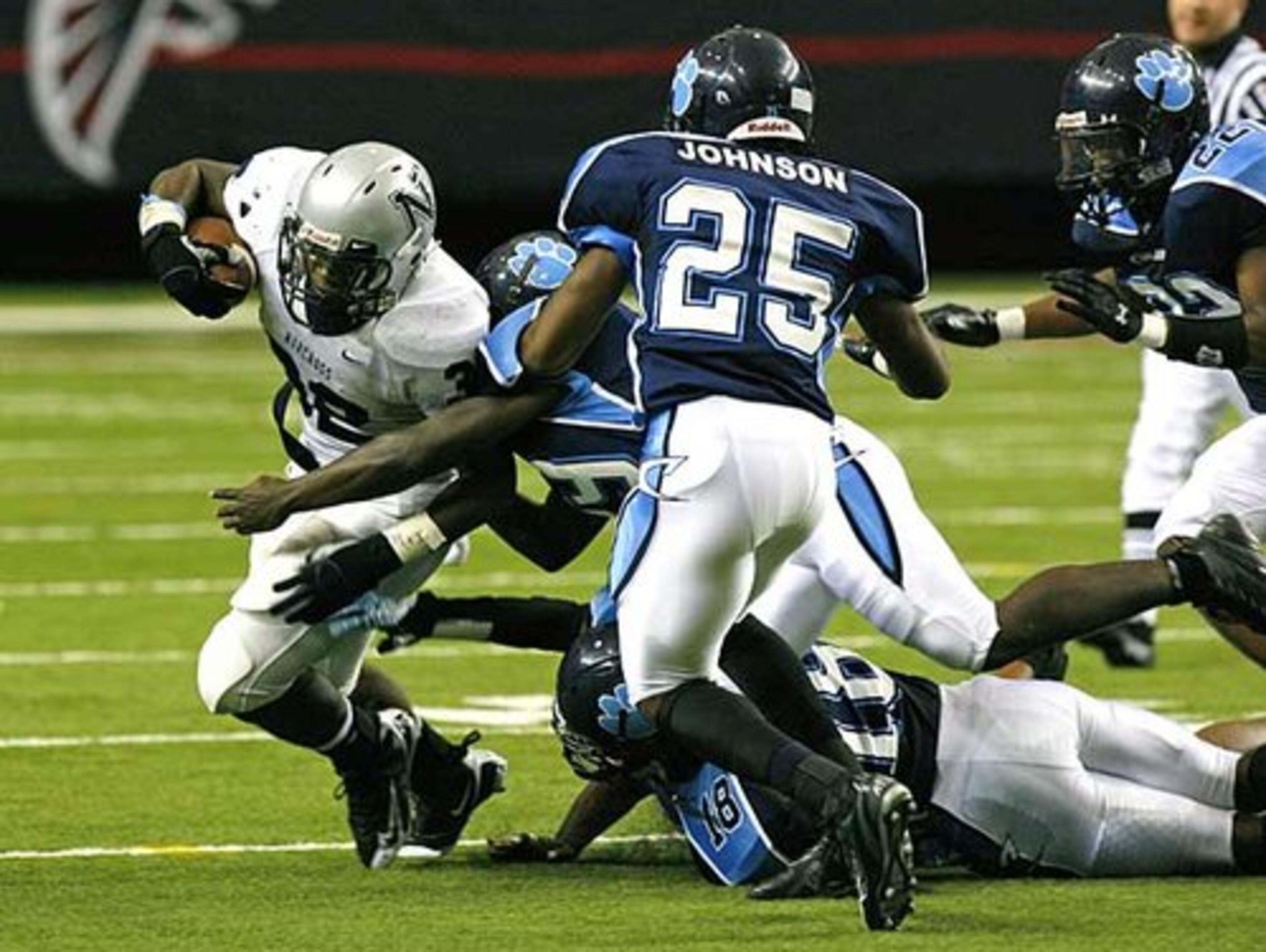 Norcross's D.J. Adams (left, with ball) is a strong, natural runner who has proven that he can carry the ball 20 times a game. Committed to Maryland.