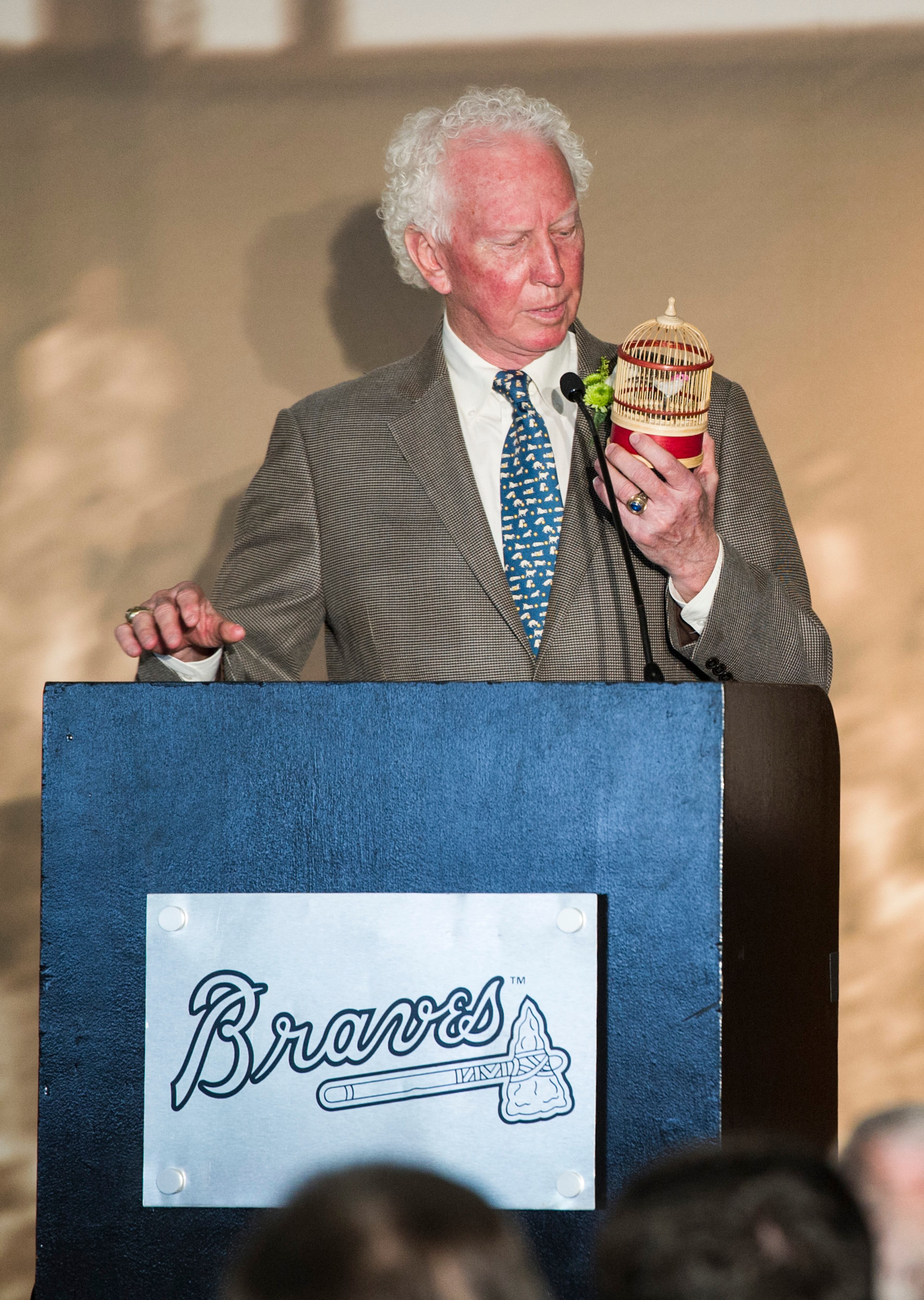 Don Sutton promises to tweet more as he pulls out a tweety bird cage during the Atlanta Braves Hall of Fame luncheon inducting him as a broadcaster, Monday, July 20, 2015, at Turner Field in Atlanta. (Photo/John Amis)