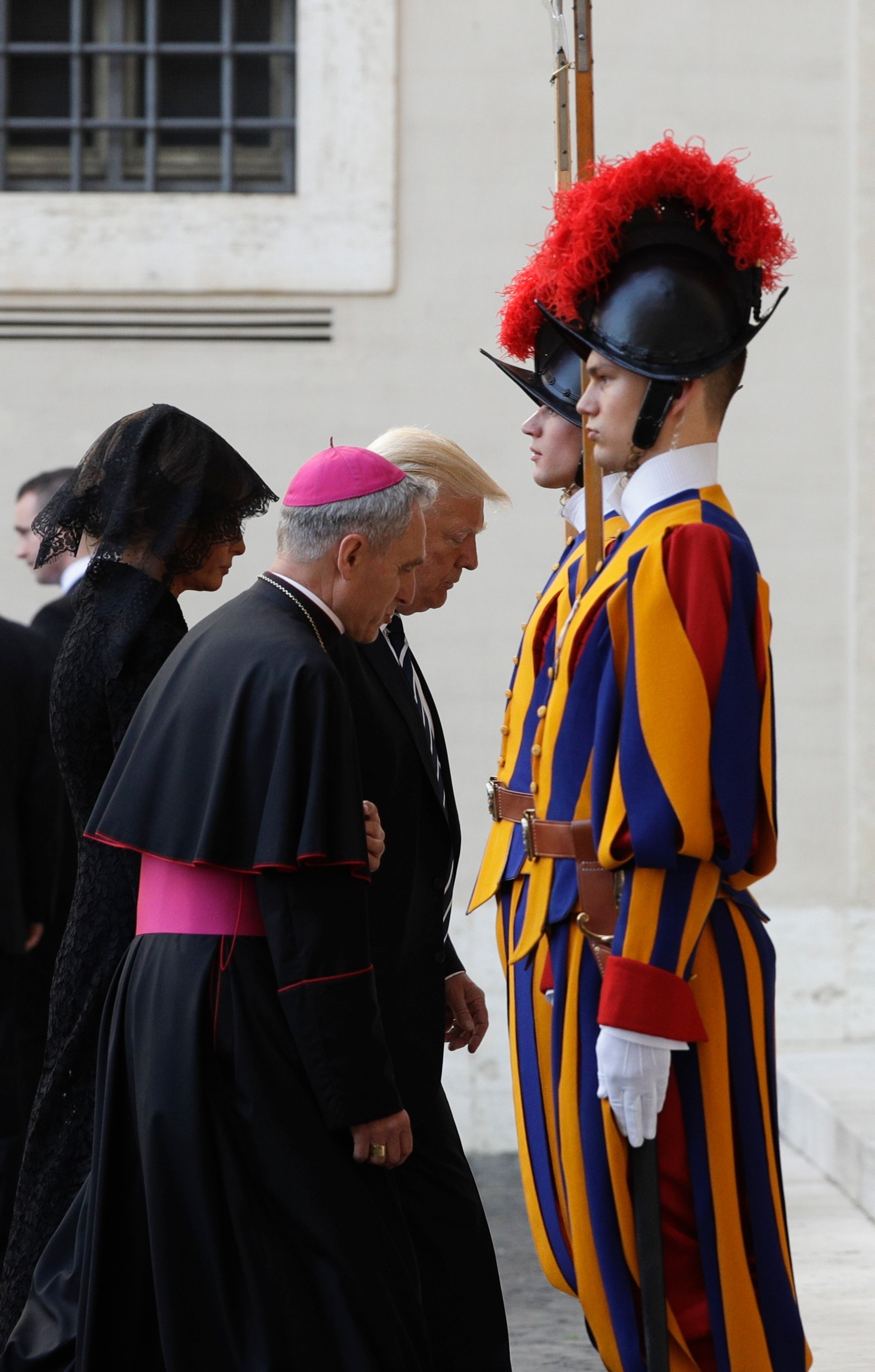 President Donald Trump and his wife Melania arrive at the San Damaso courtyard for his private audience with Pope Francis, at the Vatican, Wednesday, May 24, 2017. (AP Photo/Gregorio Borgia)