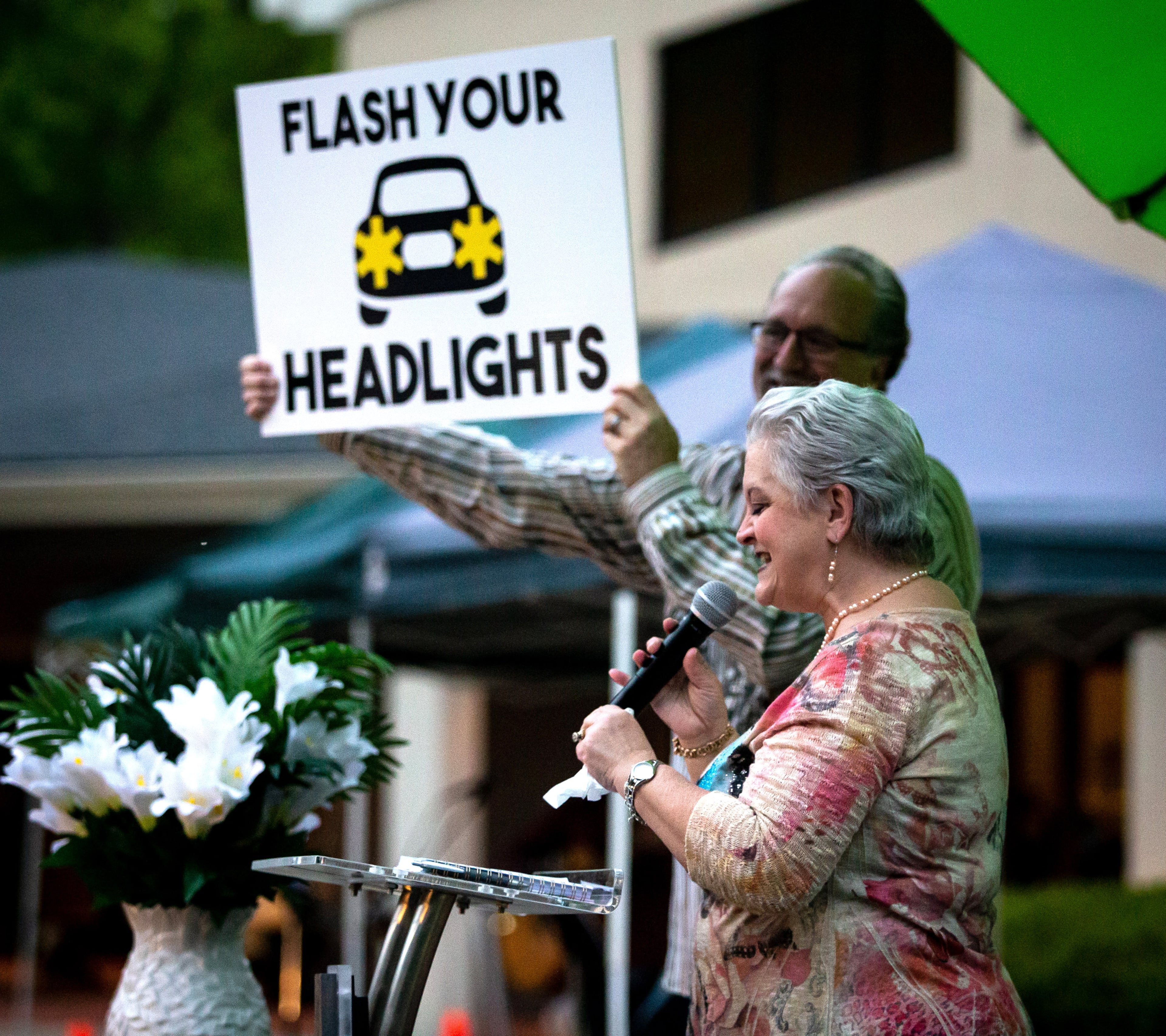 Missy Osbon and her husband, Pastor Shell Osbon, greet the crowd at the beginning of the Easter Drive-in church service at the Life Church Smyrna Assembly of God Sunday, April 12, 2020. STEVE SCHAEFER / SPECIAL TO THE AJC