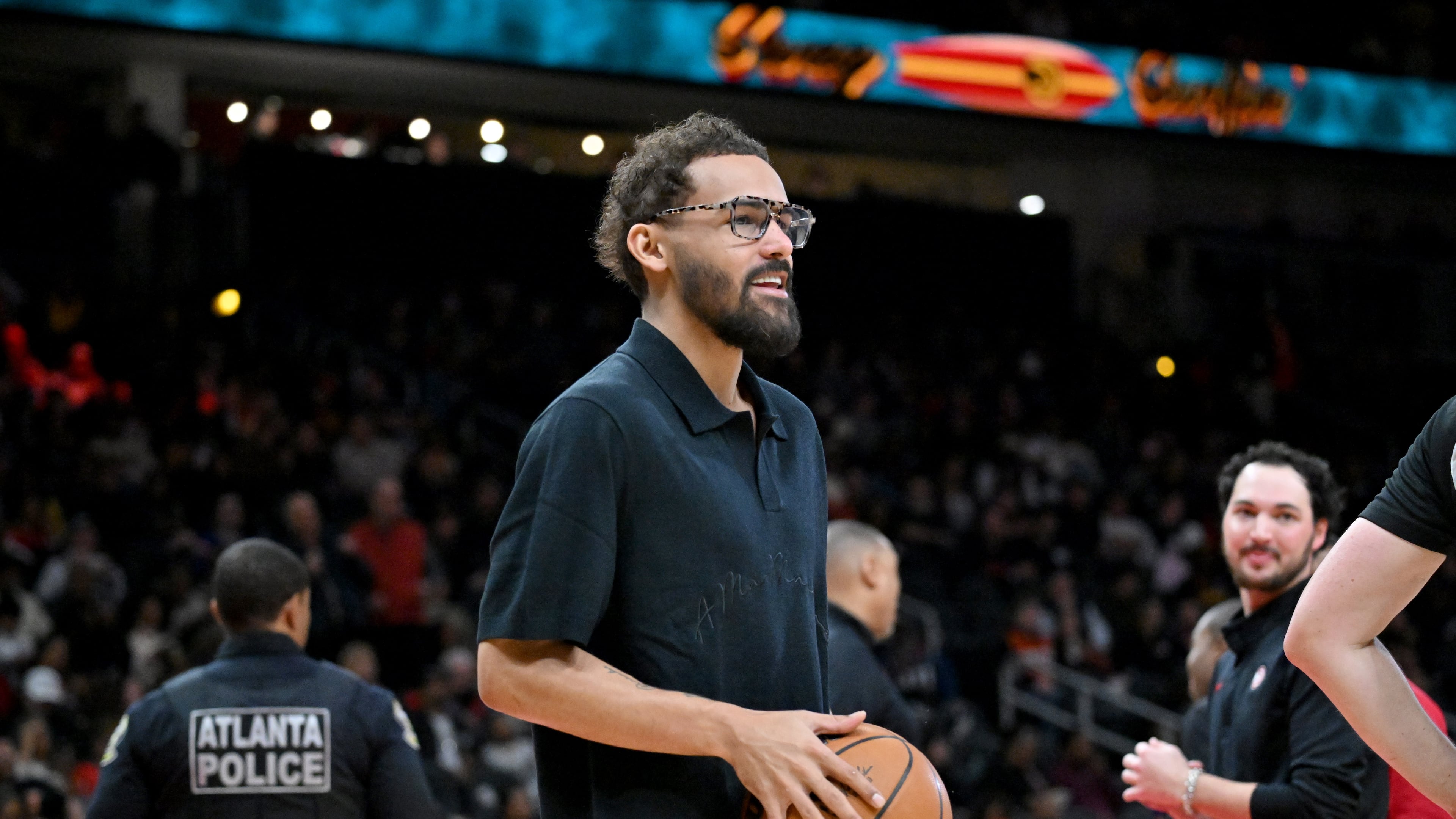 Hawks guard Trae Young holds a basketball during timeout Wednesday, Jan. 7, 2026, against the Pelicans at State Farm Arena in Atlanta. With word of a pending trade imminent, Young sat out the game and later left the bench after the deal became official. (Hyosub Shin/AJC)