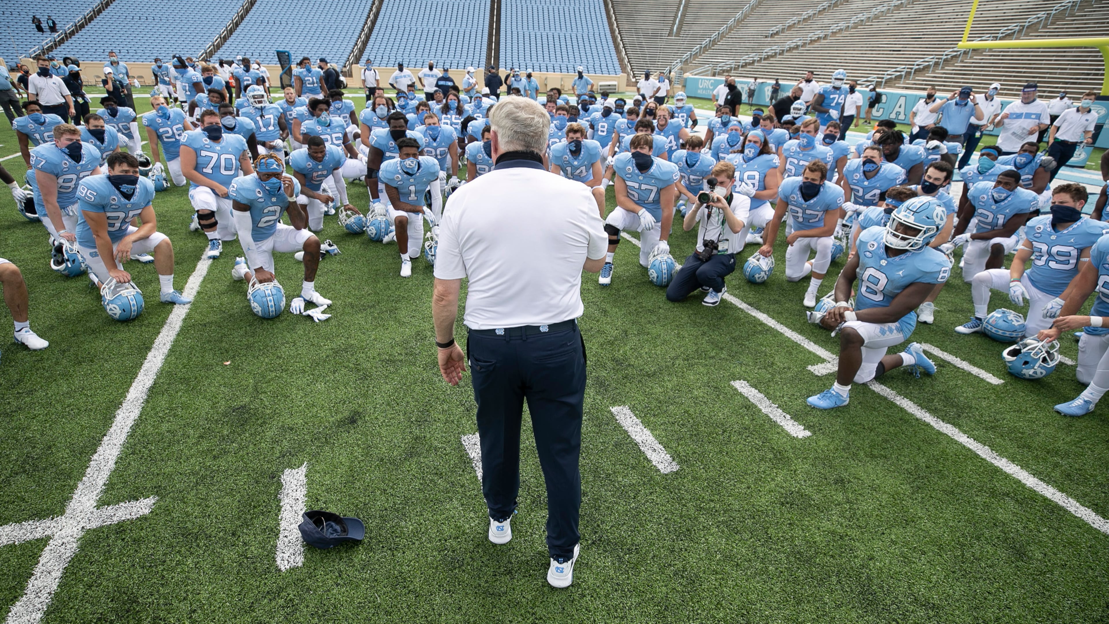 On September 12, 2020, North Carolina head coach Mack Brown meets with his team following a win against Syracuse at Kenan Stadium in Chapel Hill, North Carolina. Brown's Tar Heels were back in action on Saturday, Oct. 10, 2020, sweeping aside No. 19 Virginia Tech, 56-45. (Robert Willett/The Raleigh News & Observer/TNS)