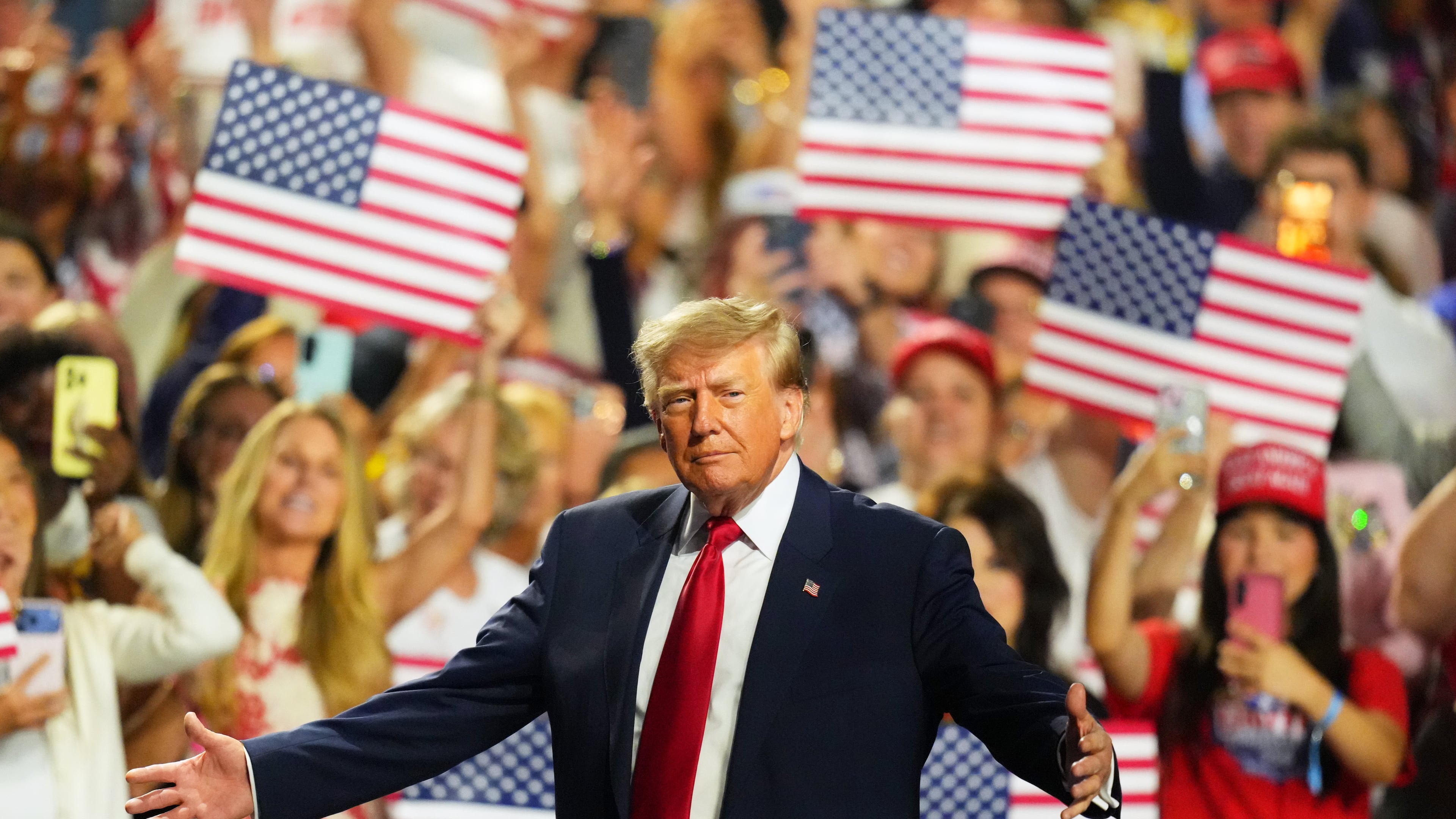 President Donald Trump greets supporters as he arrives on the stage at the Republican convention Thursday, Sept. 10, 2026, in Dallas. (AP Photo/Julio Cortez)