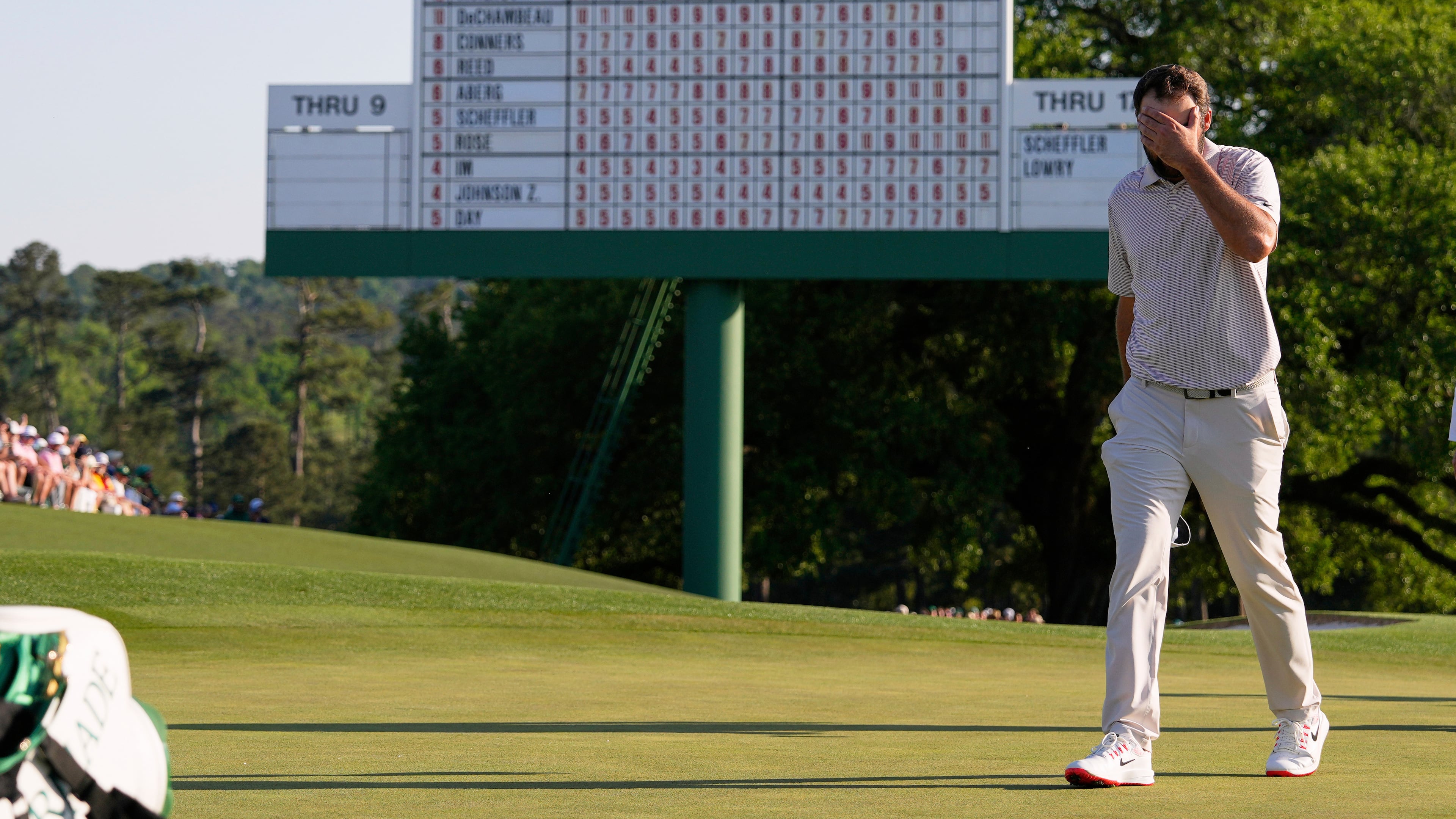 FILE - Scottie Scheffler walks off the green on the 18th hole during the final round at the Masters golf tournament, Sunday, April 13, 2025, in Augusta, Ga. (AP Photo/David J. Phillip, File)