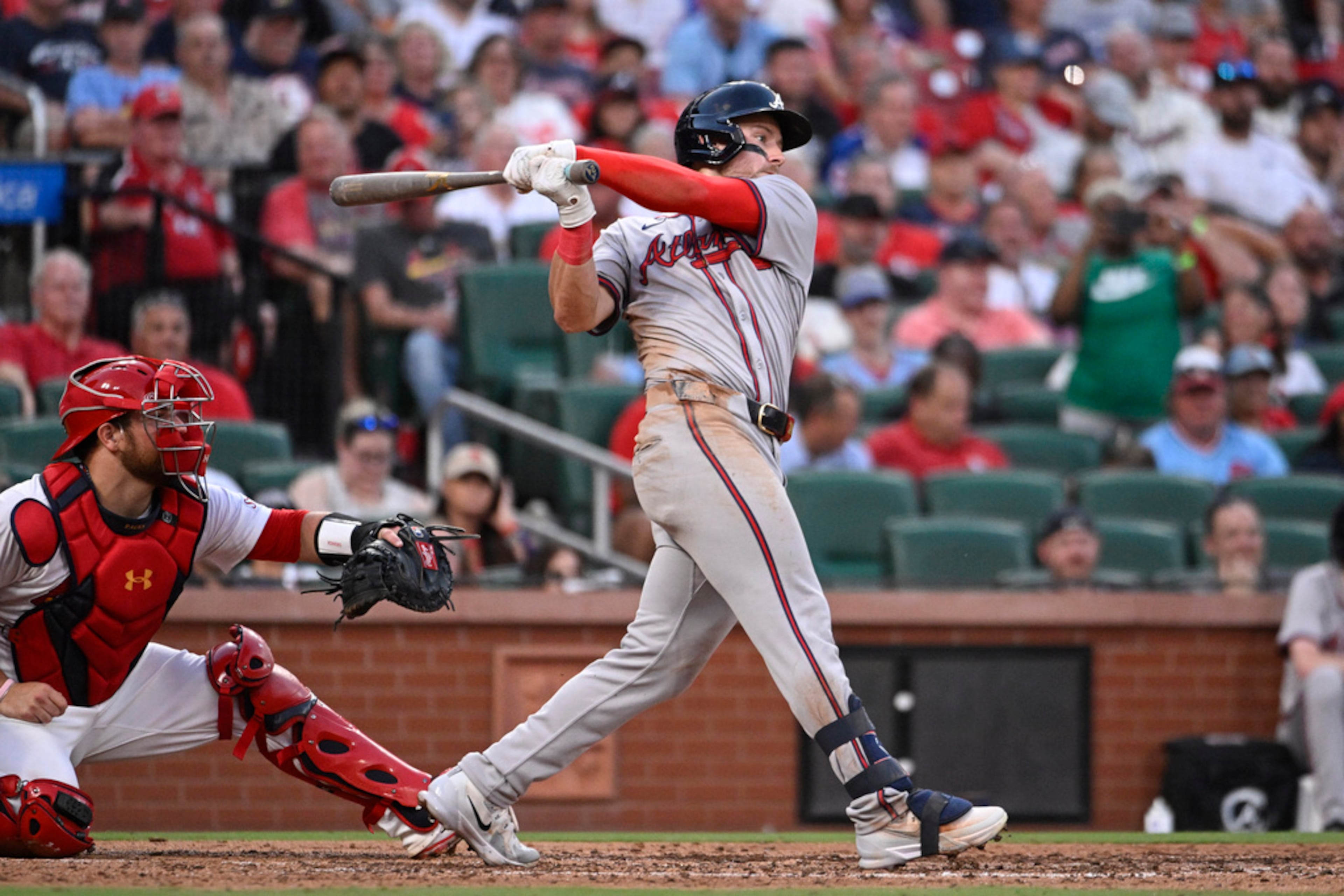 Atlanta Braves' Jarred Kelenic watches his RBI single next to St. Louis Cardinals catcher Pedro Pages during the eighth inning in the second game of a baseball doubleheader Wednesday, June 26, 2024, in St. Louis. (AP Photo/Joe Puetz)