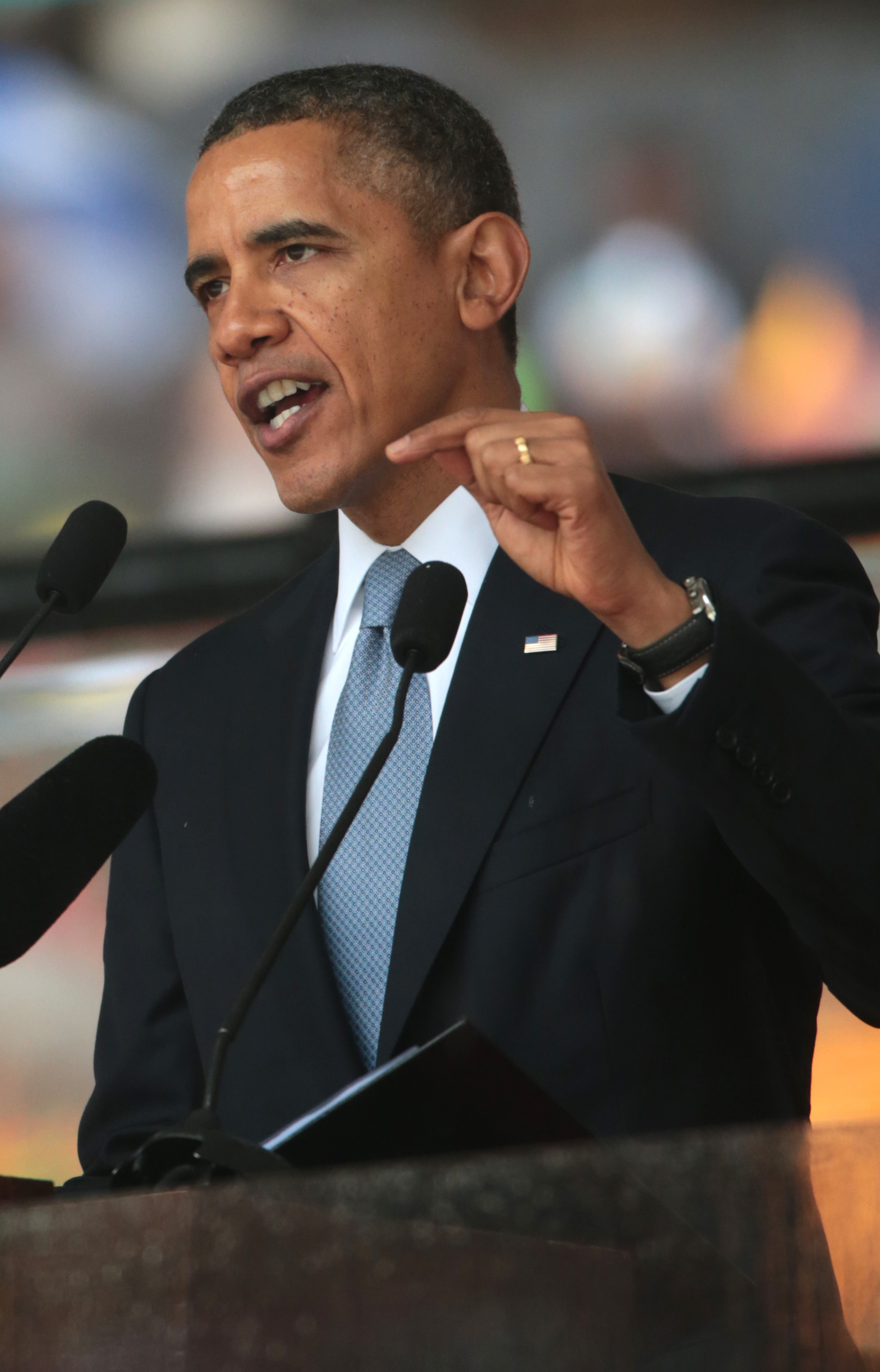 United States President Barack Obama speaks during the official memorial service for former South African President Nelson Mandela at the FNB Stadium on December 10, 2013 in Johannesburg, South Africa. Over 60 heads of state have travelled to South Africa to attend a week of events commemorating the life of former South African President Nelson Mandela. Mr Mandela passed away on the evening of December 5, 2013 at his home in Houghton at the age of 95. Mandela became South Africa's first black president in 1994 after spending 27 years in jail for his activism against apartheid in a racially-divided South Africa. (Photo by Christopher Furlong/Getty Images)
