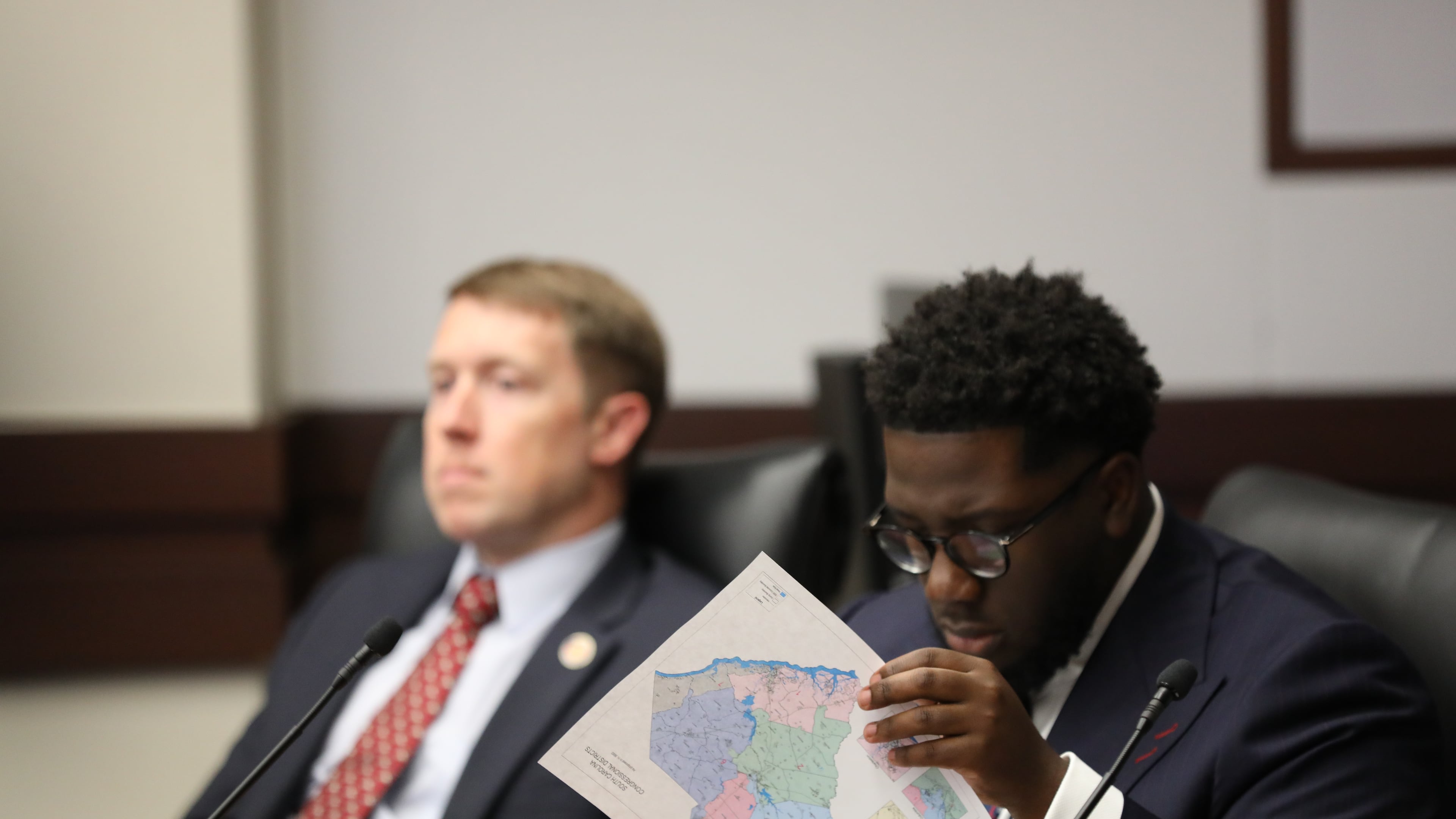 South Carolina Democratic Rep. Keishan Scott looks at a proposed U.S. House district map during a redistricting hearing in a state House Judiciary subcommittee on Tuesday, May, 12 2026, in Columbia, S.C. (AP Photo/Jeffrey Collins)