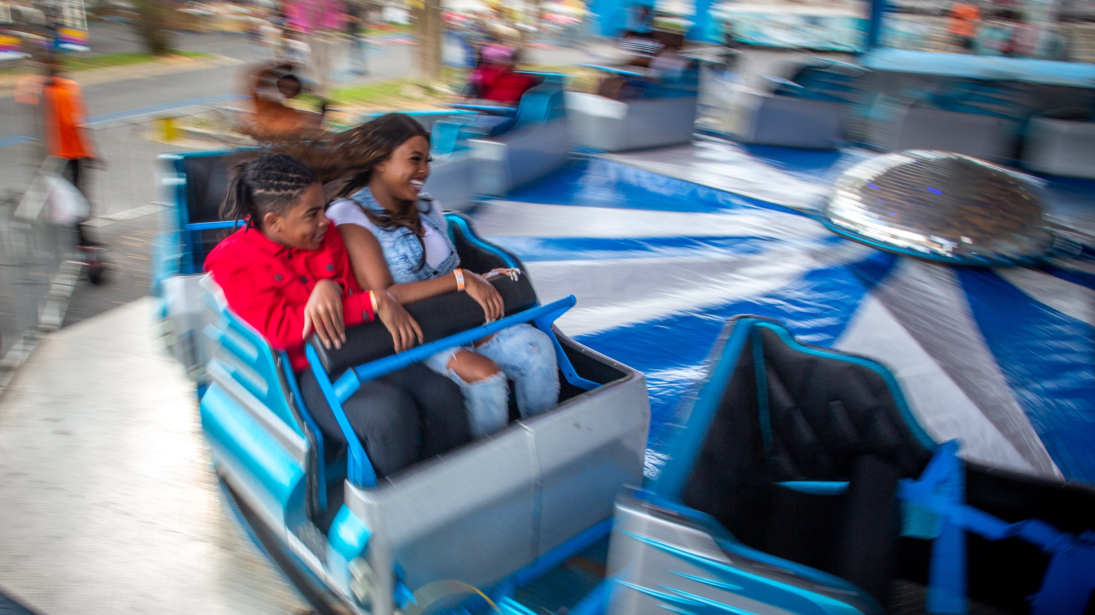 People enjoy the rides at the Atlanta Fair on Sunday, March 6, 2022. This was the opening weekend for the annual fair that runs through April 10. (Photo by Steve Schaefer for The Atlanta Journal-Constitution)