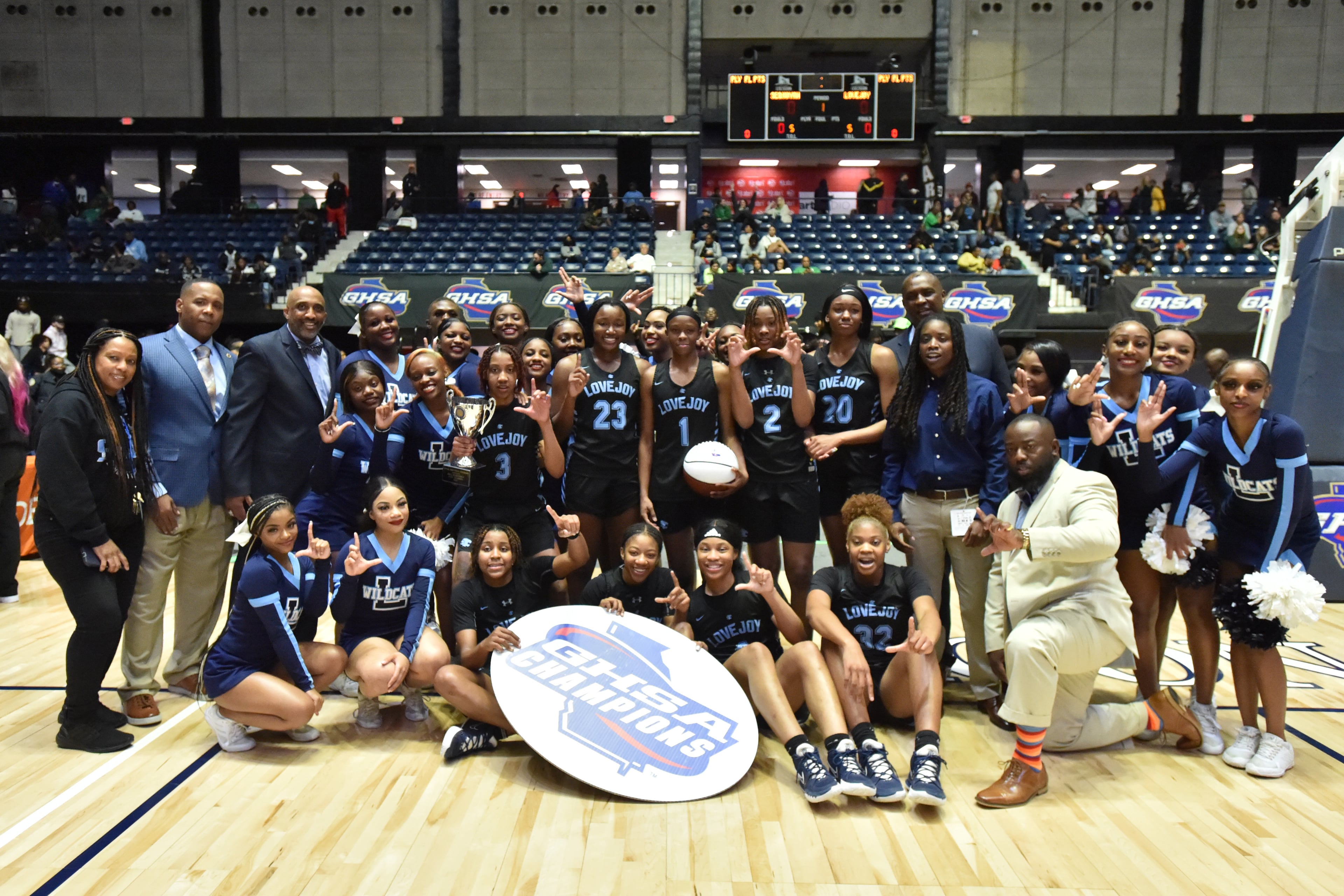 March 11, 2022 Macon - Lovejoy players celebrate their victory over Sequoyah during the 2022 GHSA State Basketball Class AAAAAA Girls Championship game at the Macon Centreplex in Macon on Friday, March 11, 2022. Lovejoy won 54-38 over Sequoyah. (Hyosub Shin / Hyosub.Shin@ajc.com)