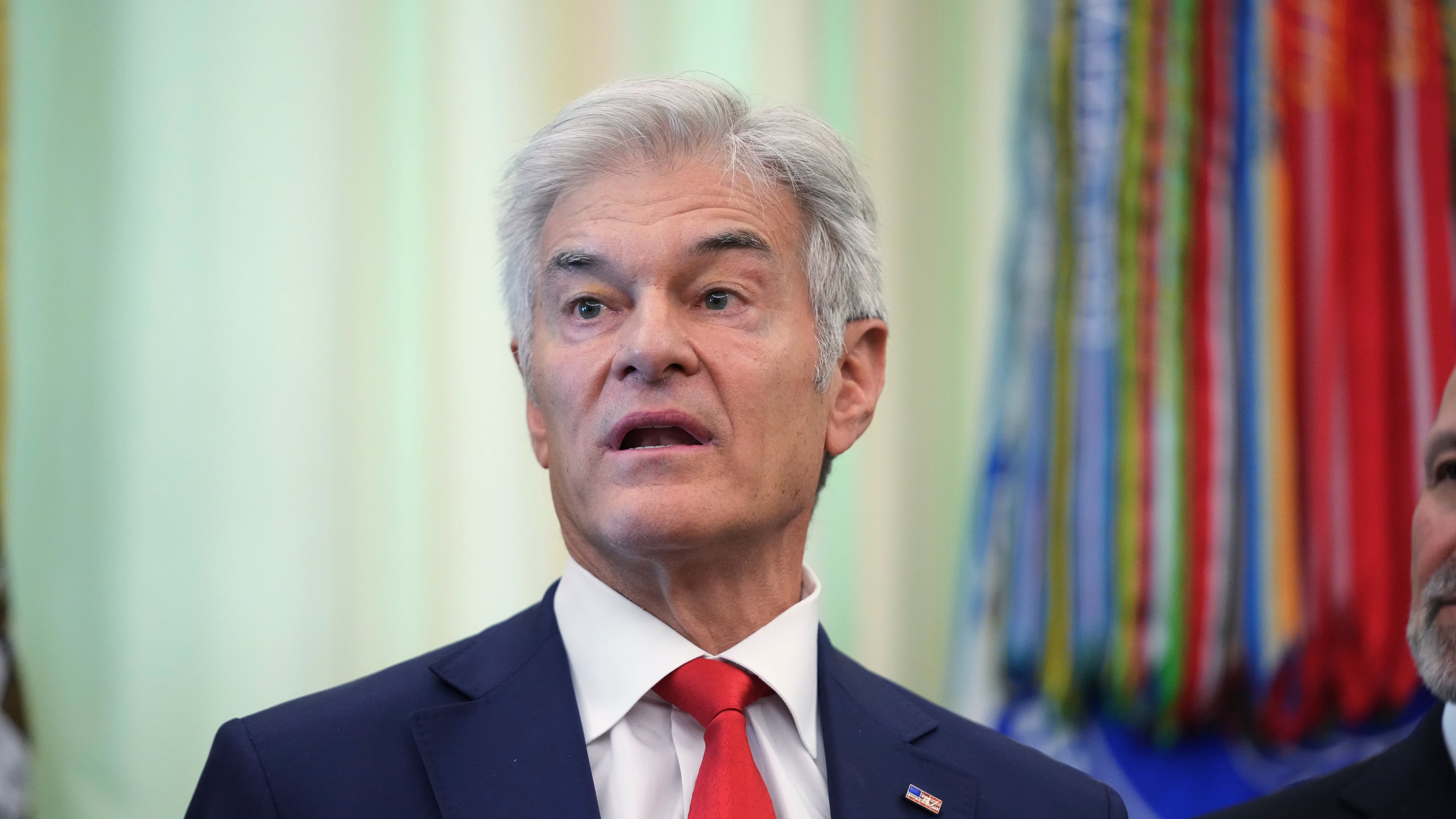 Centers for Medicare & Medicaid Services administrator Dr. Mehmet Oz speaks speaks during an event on health care affordability in the Oval Office at the White House, Thursday, April 23, 2026, in Washington. (AP Photo/Mark Schiefelbein)