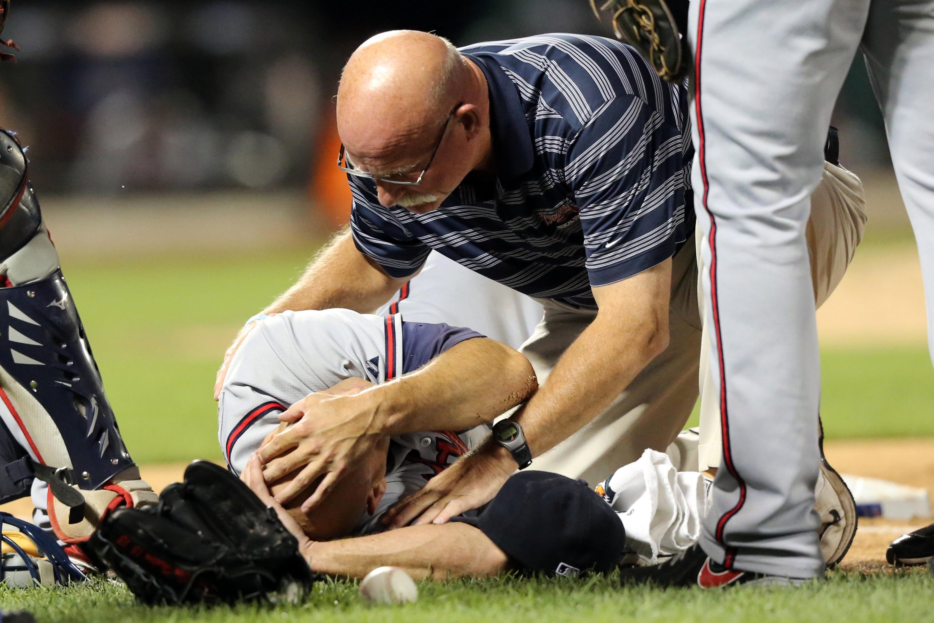 Braves starting pitcher Tim Hudson was injured in a collision at first base with New York Mets left fielder Eric Young Jr. Wednesday night in New York.
