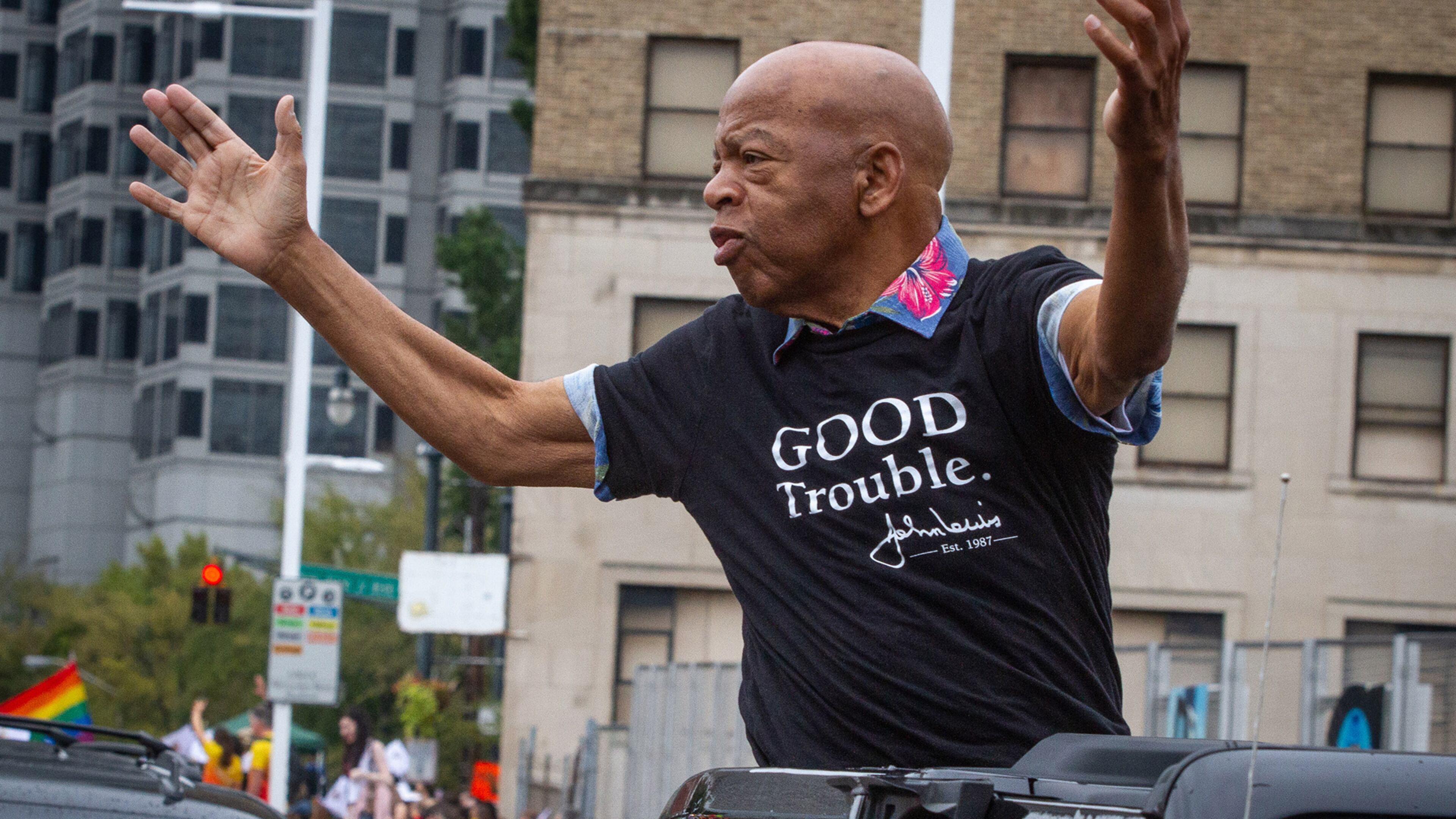 Congressman John Lewis waves to the crowd as he makes his way down Peachtree Street during the 49th Annual Pride Festival and Parade in 2019. Lewis was an early supporter of gay rights and attended the parade for years. STEVE SCHAEFER / SPECIAL TO THE AJC