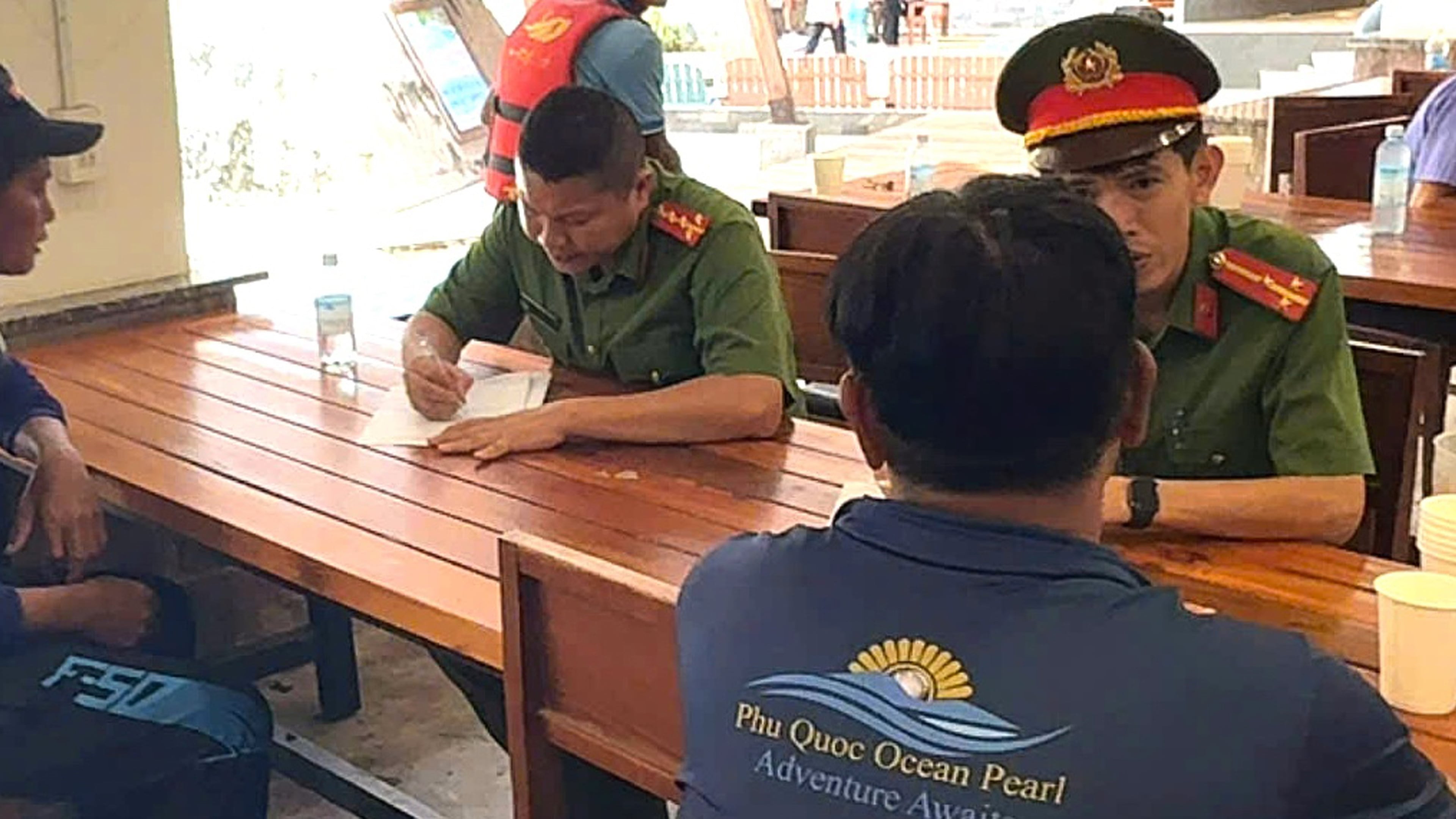 Investigators with crew members involved in the speedboat incident in Phu Quoc, Vietnam, Sunday, July 12, 2026. (VNA/Tran Van Si)
