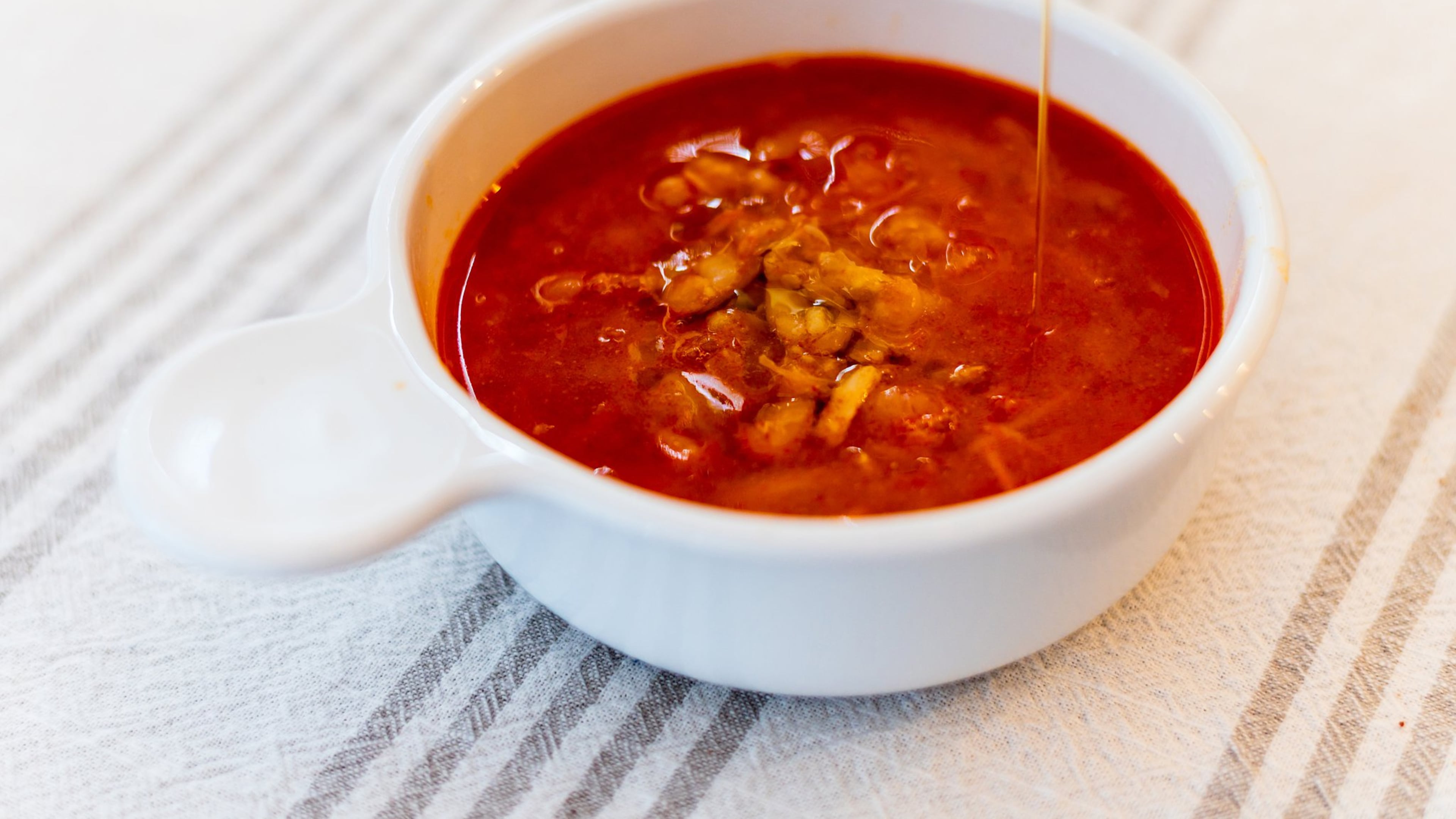 To give some body to Garlicky White Bean Soup with Smoked Paprika and Lemon, you need to smash about half of the simmered beans into the broth while preparing the soup. CONTRIBUTED BY HENRI HOLLIS