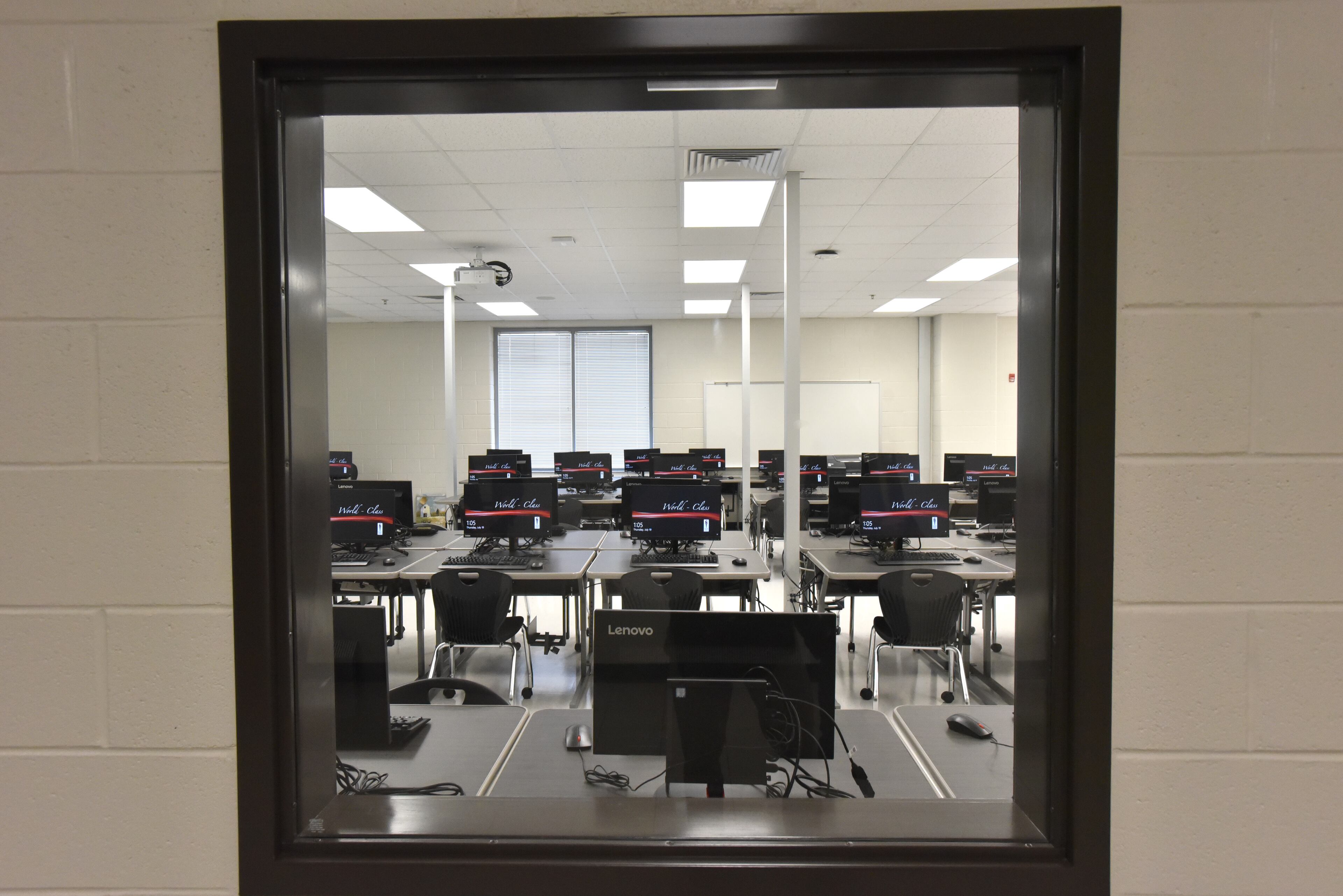 Computer lab can be seen through the window at Paul Duke STEM High School on Thursday, July 19, 2018.