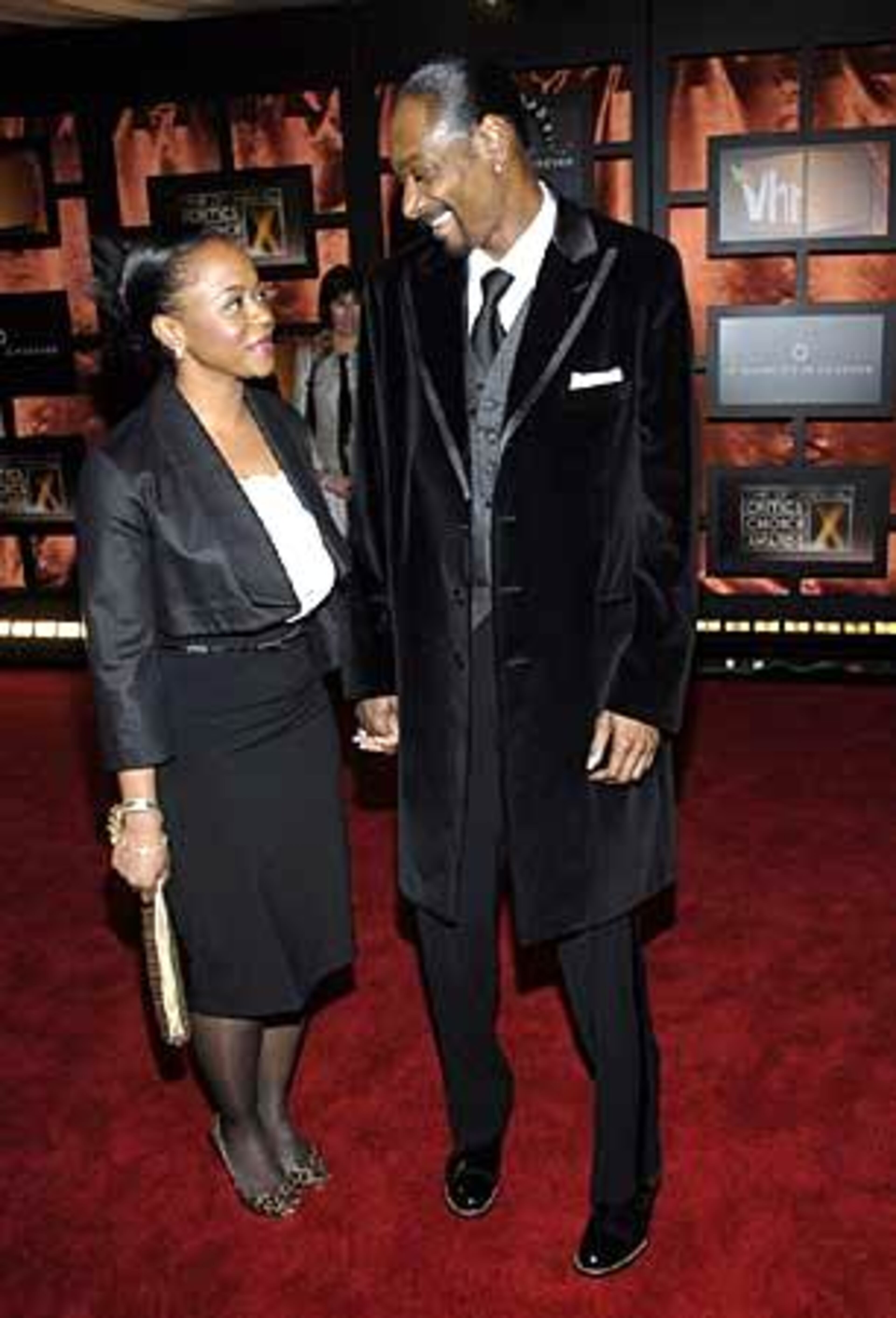 Rapper Snoop Dogg and his wife, Shante Taylor, arrive.