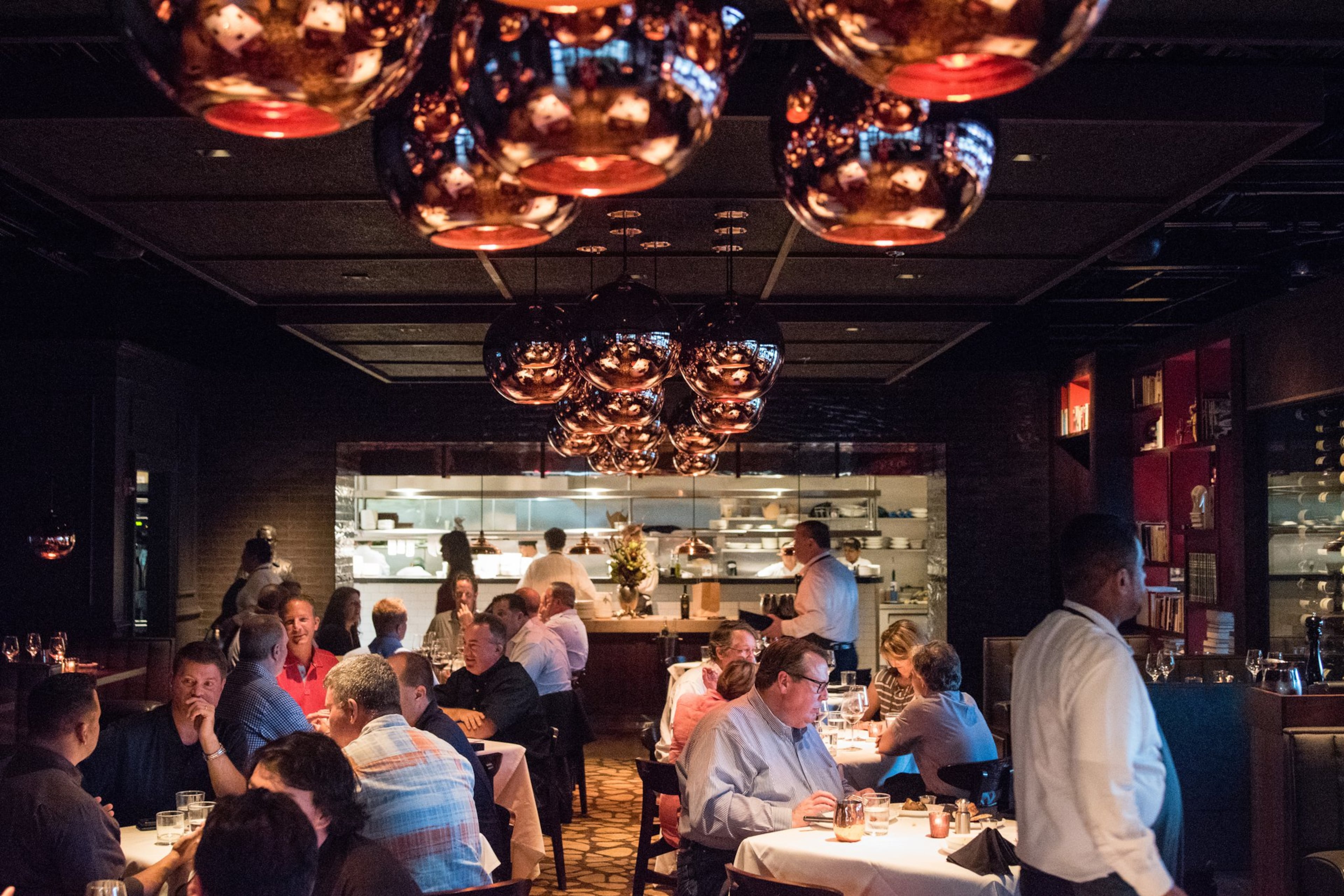 The main dining room at Kaiser’s Chophouse looks into the open kitchen. CONTRIBUTED BY HENRI HOLLIS