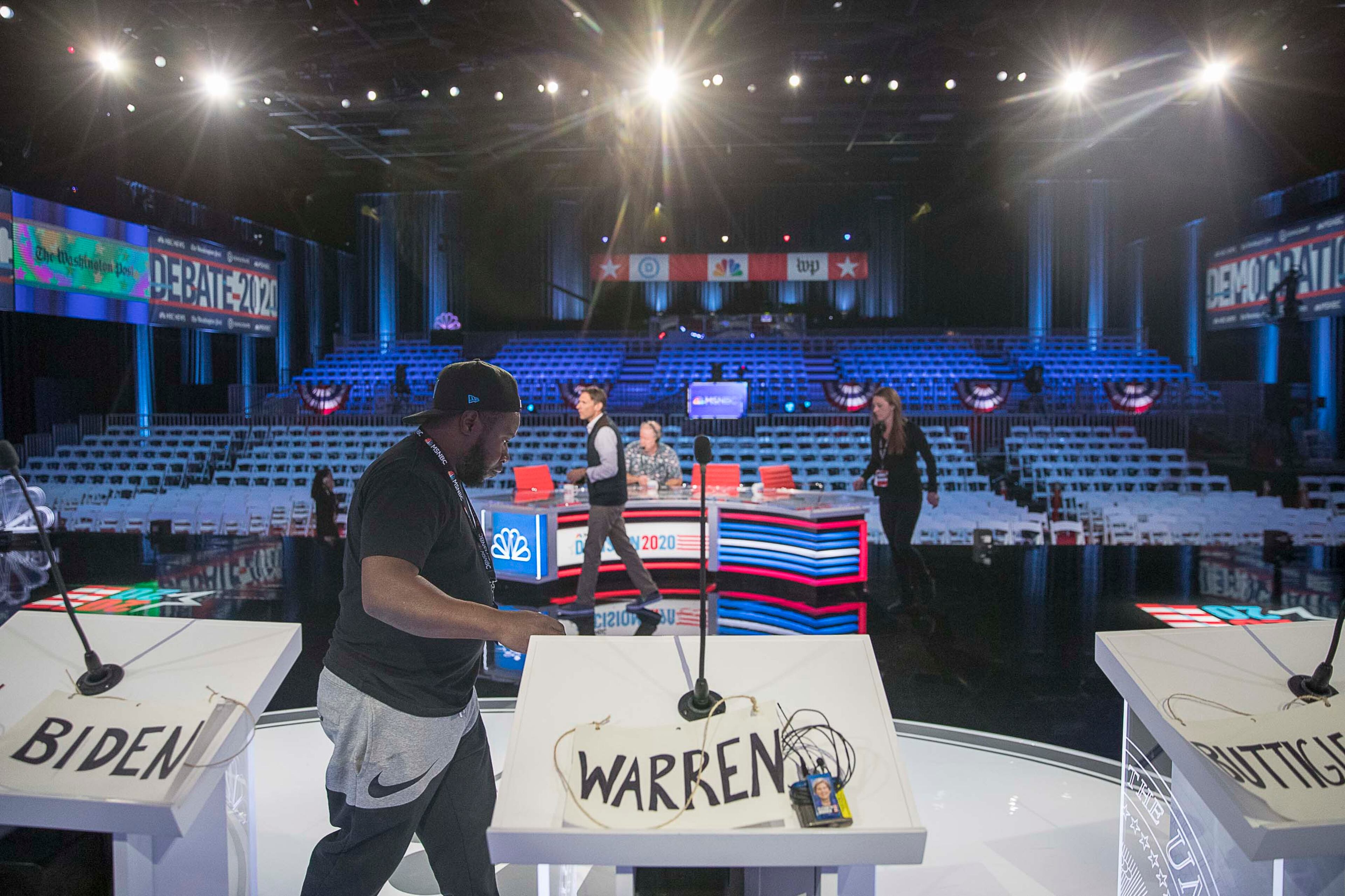 11/19/2019 -- Atlanta, Georgia -- Podiums are set up for Democratic presidential candidates as crews continue to work on the final touches of the debate stage for the MSNBC/The Washington Post Democratic Presidential debate inside the Oprah Winfrey Soundstage at Tyler Perry Studios in Atlanta, Tuesday, November 19, 2019. This is the fifth debate for the 2020 presidential race. (Alyssa Pointer/Atlanta Journal Constitution)