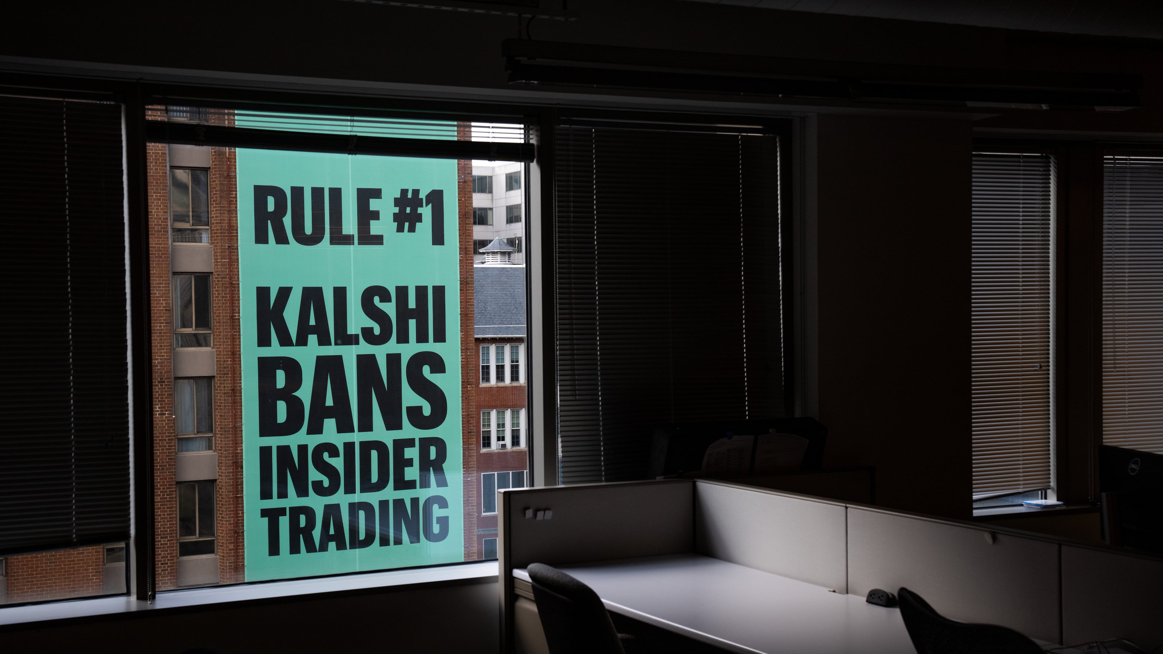 FILE - A banner for the prediction market platform Kalshi hangs from a building in Washington, Wednesday, April 1, 2026. (AP Photo/Allison Robbert, File)