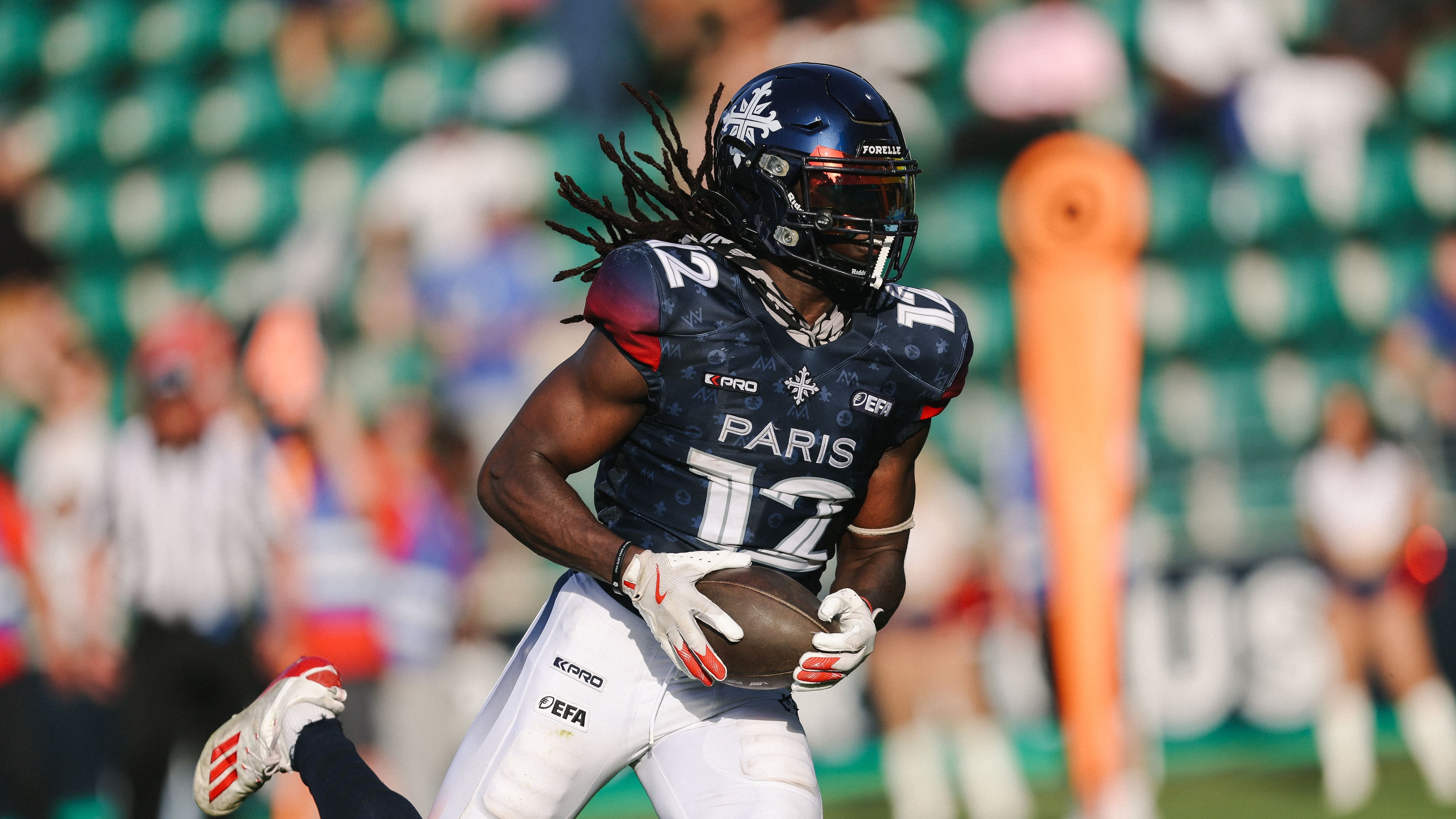 This photo provided by Maxime Le Pihif shows Paris Musketeers wide receiver Hugo Tekedam catching a pass during a game against the Prague Lions on May 24, 2026, in Saint-Ouen-sur-Seine, France. (Maxime Le Pihif via AP)