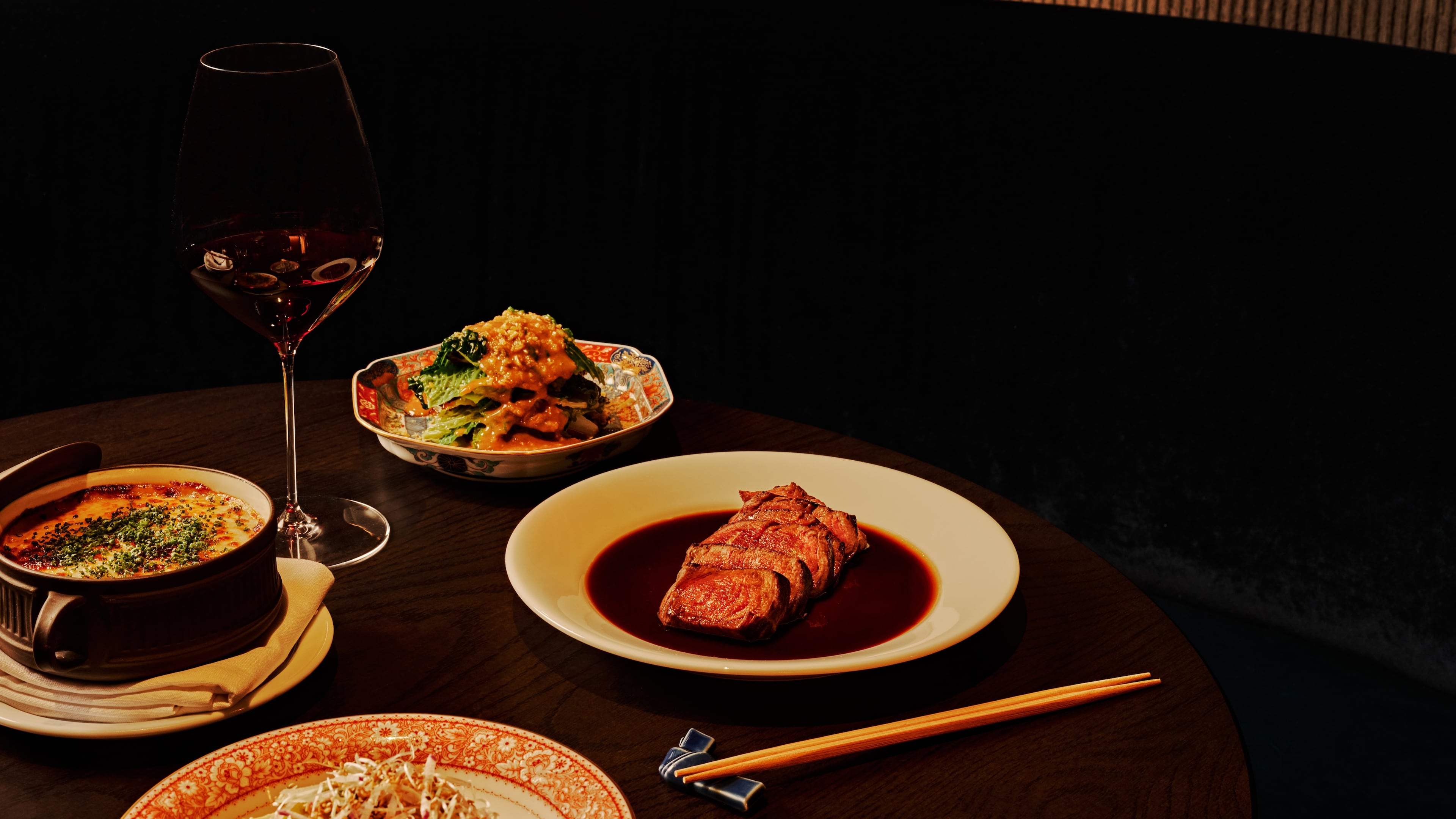 The American wagyu filet mignon (right) at Koshu Club. The restaurant sources beef as painstakingly as a high-end omakase restaurant sources its fish. (Andrew Thomas Lee/Courtesy of Koshu Club)
