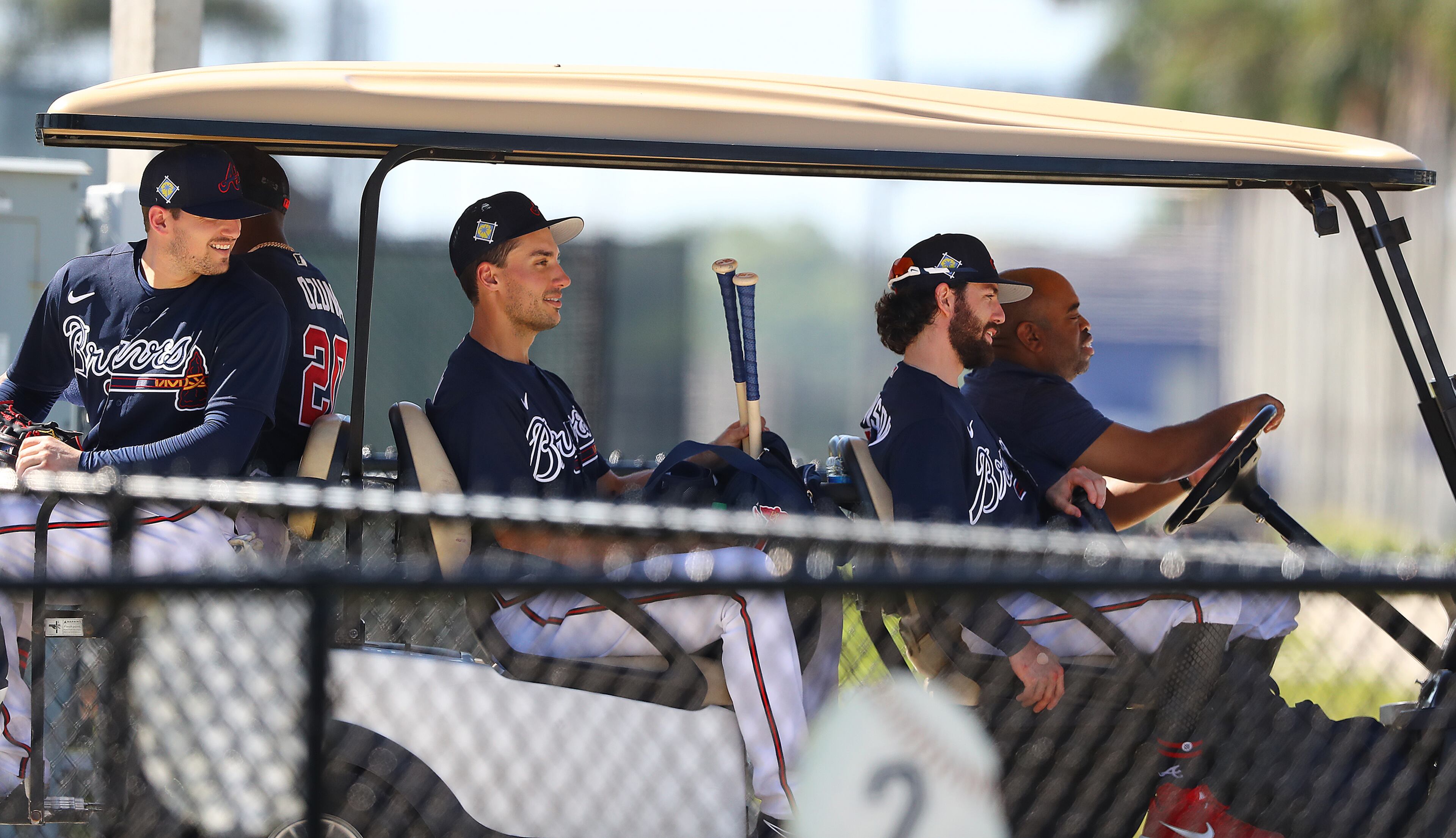 Braves players (from left) Austin Riley, Marcell Ozuna, Matt Olson and Dansby Swanson get a ride back to the clubhouse on a golf cart after batting practice during Spring Training on Thursday, March 17, 2022, in North Port. “Curtis Compton / Curtis.Compton@ajc.com”