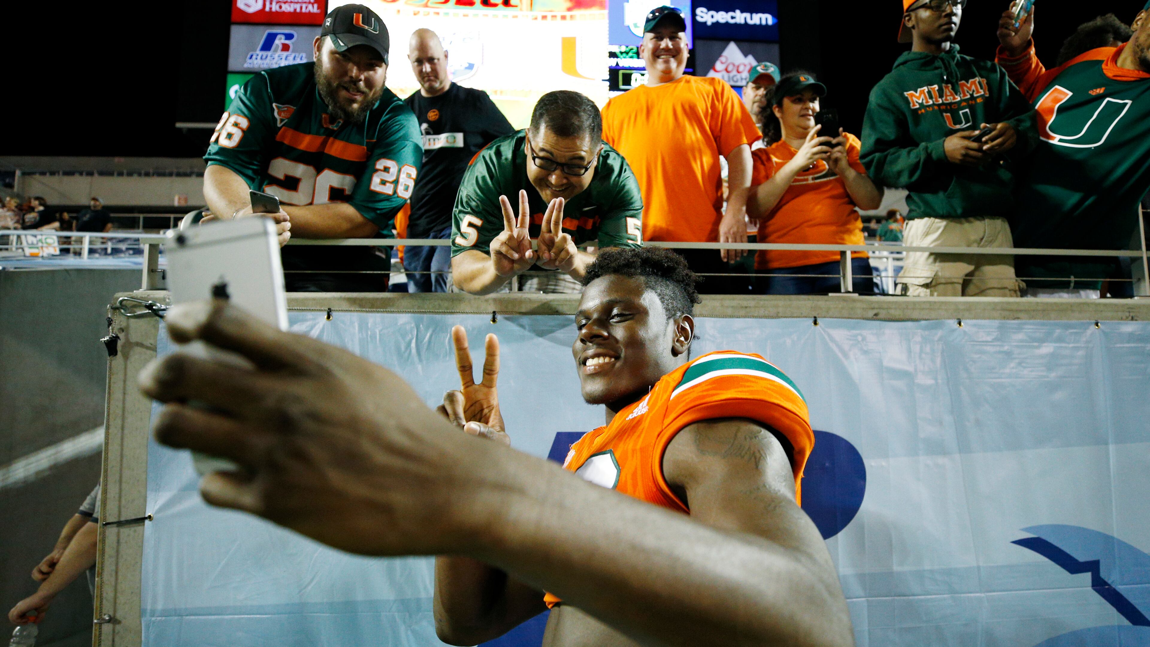 ORLANDO, FL - DECEMBER 28: David Njoku #86 of the Miami Hurricanes celebrates with fans following the Russell Athletic Bowl against the West Virginia Mountaineers at Camping World Stadium on December 28, 2016 in Orlando, Florida. Miami defeated West Virginia 31-14. (Photo by Joe Robbins/Getty Images)