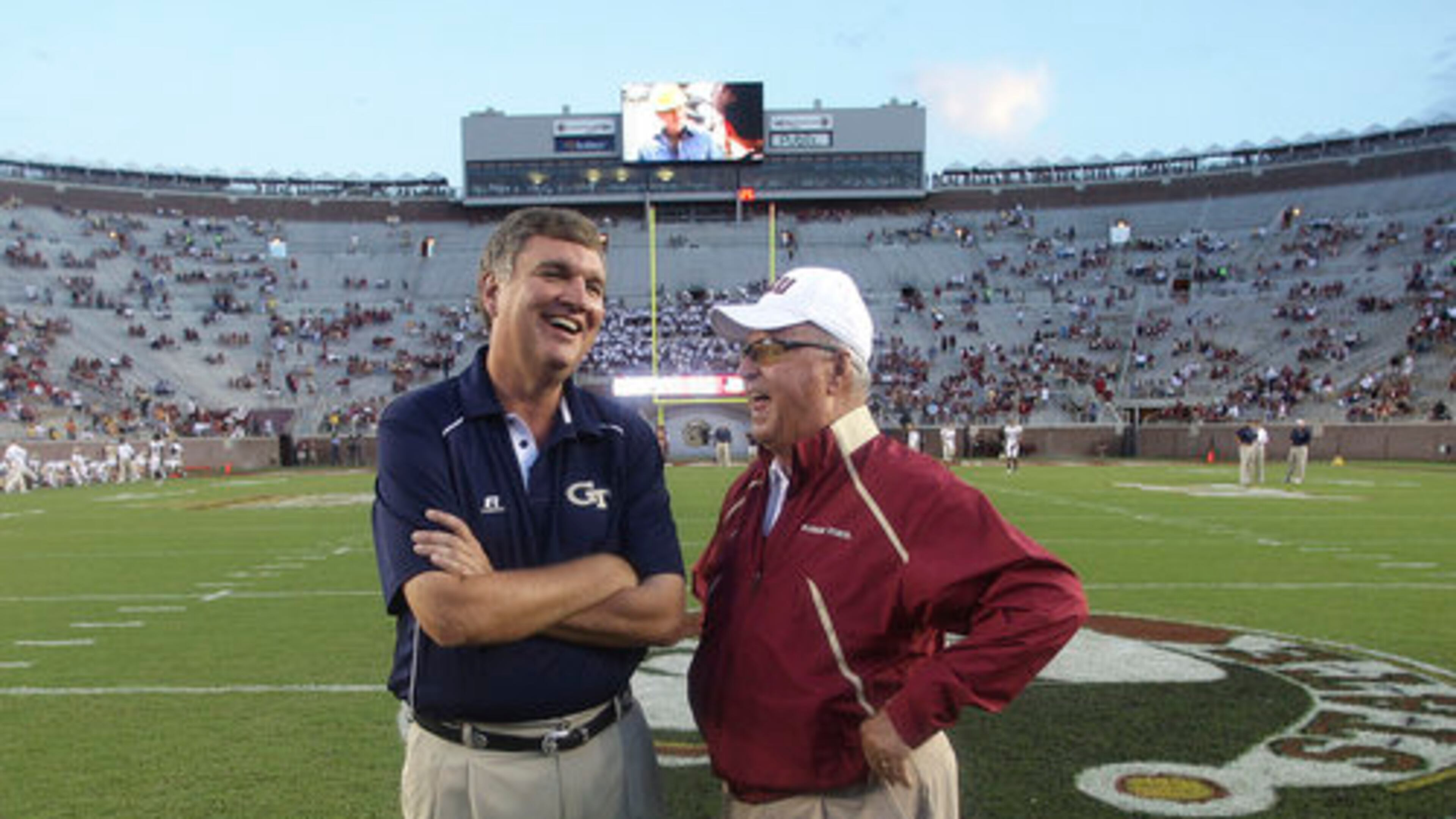 Georgia Tech coach Paul Johnson visits with Florida State coach Bobby Bowden before Saturday night's game in Tallahassee.