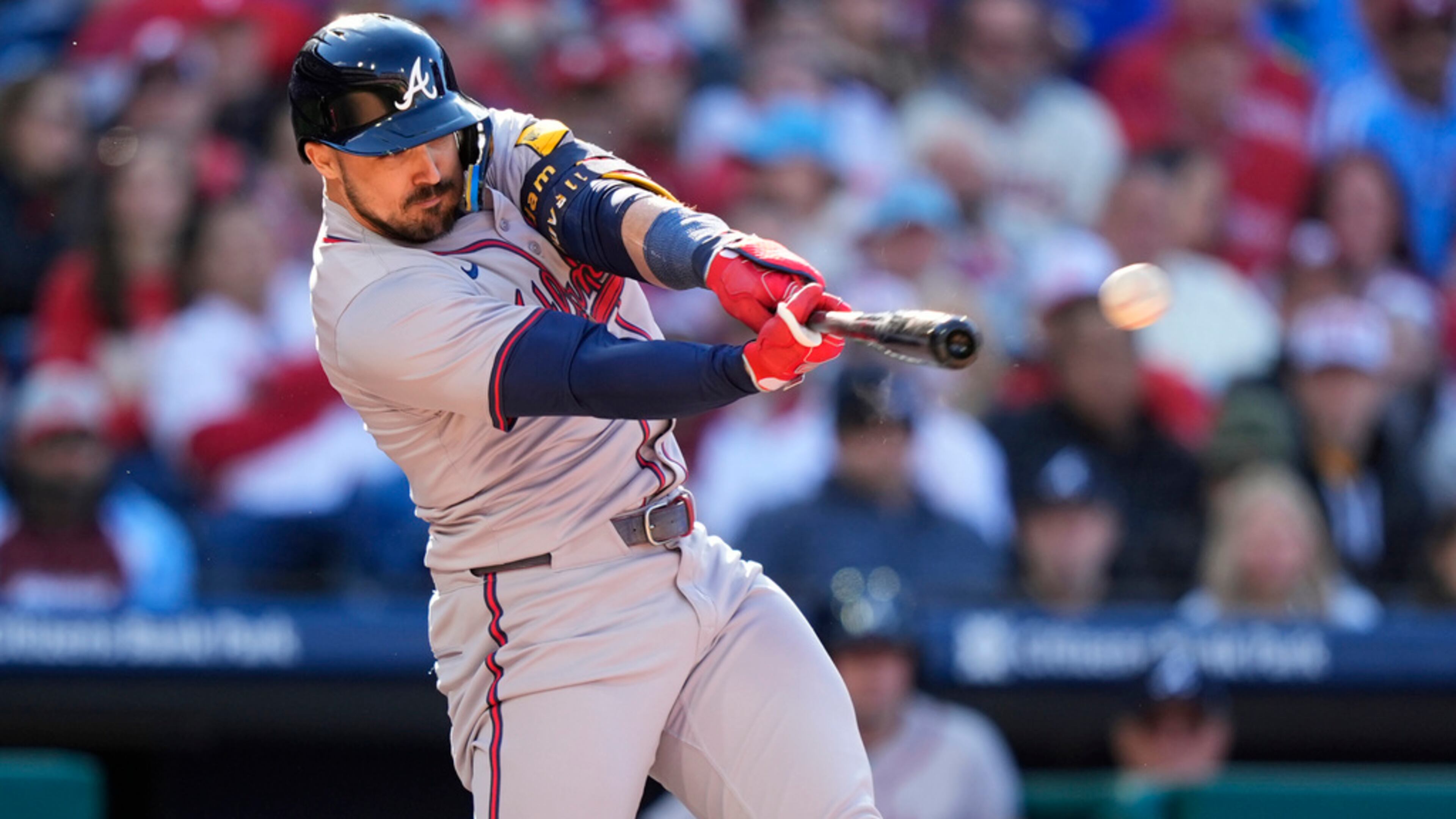 Atlanta Braves' Adam Duvall hits a two-run double off Philadelphia Phillies pitcher Matt Strahm during the seventh inning of an opening-day baseball game, Friday, March 29, 2024, in Philadelphia. (AP Photo/Matt Slocum)