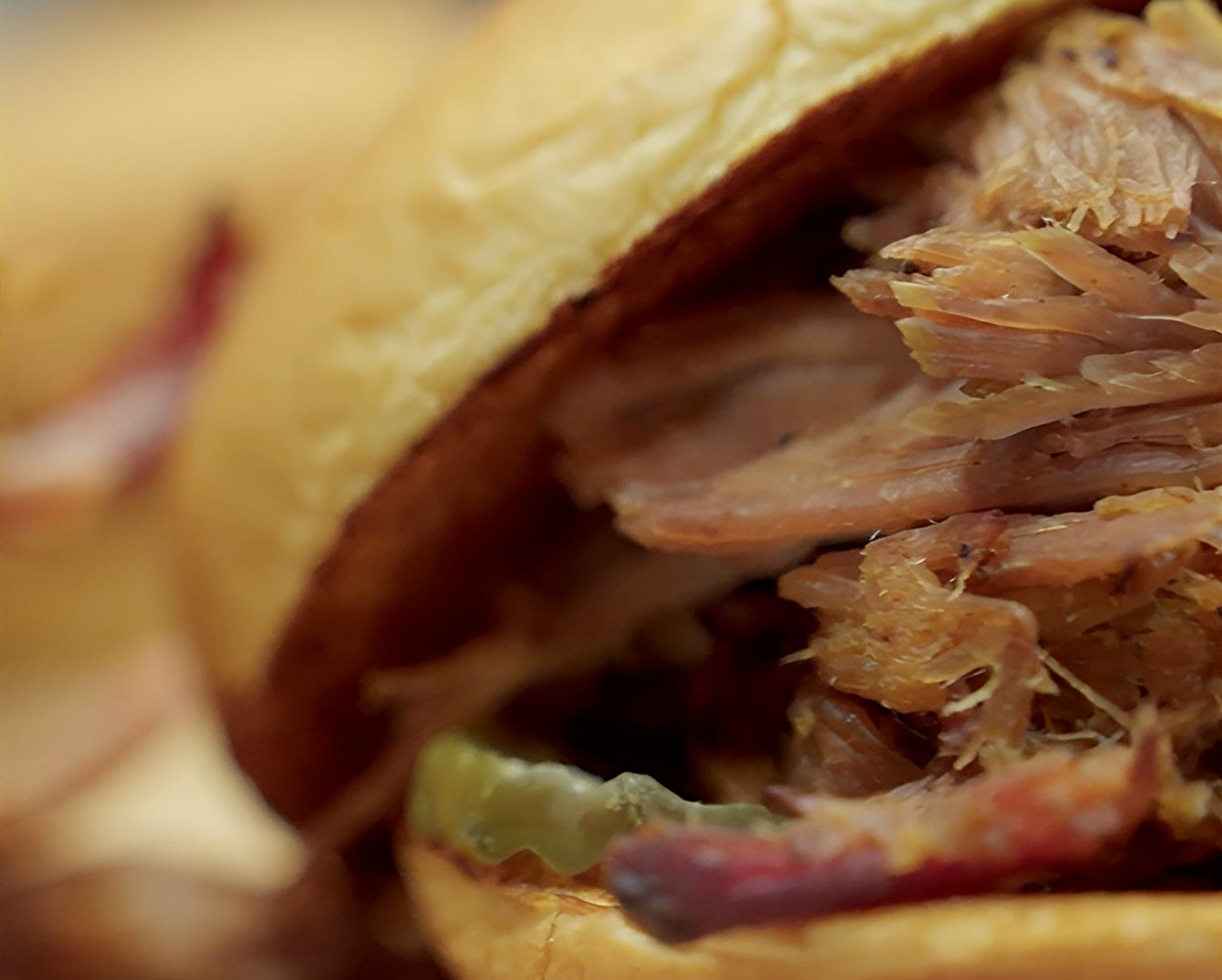 A close-up of one of the six contenders for the AJC's Best Pulled Pork Sandwich in Atlanta taste test. (Jordan Pettiford/AJC)