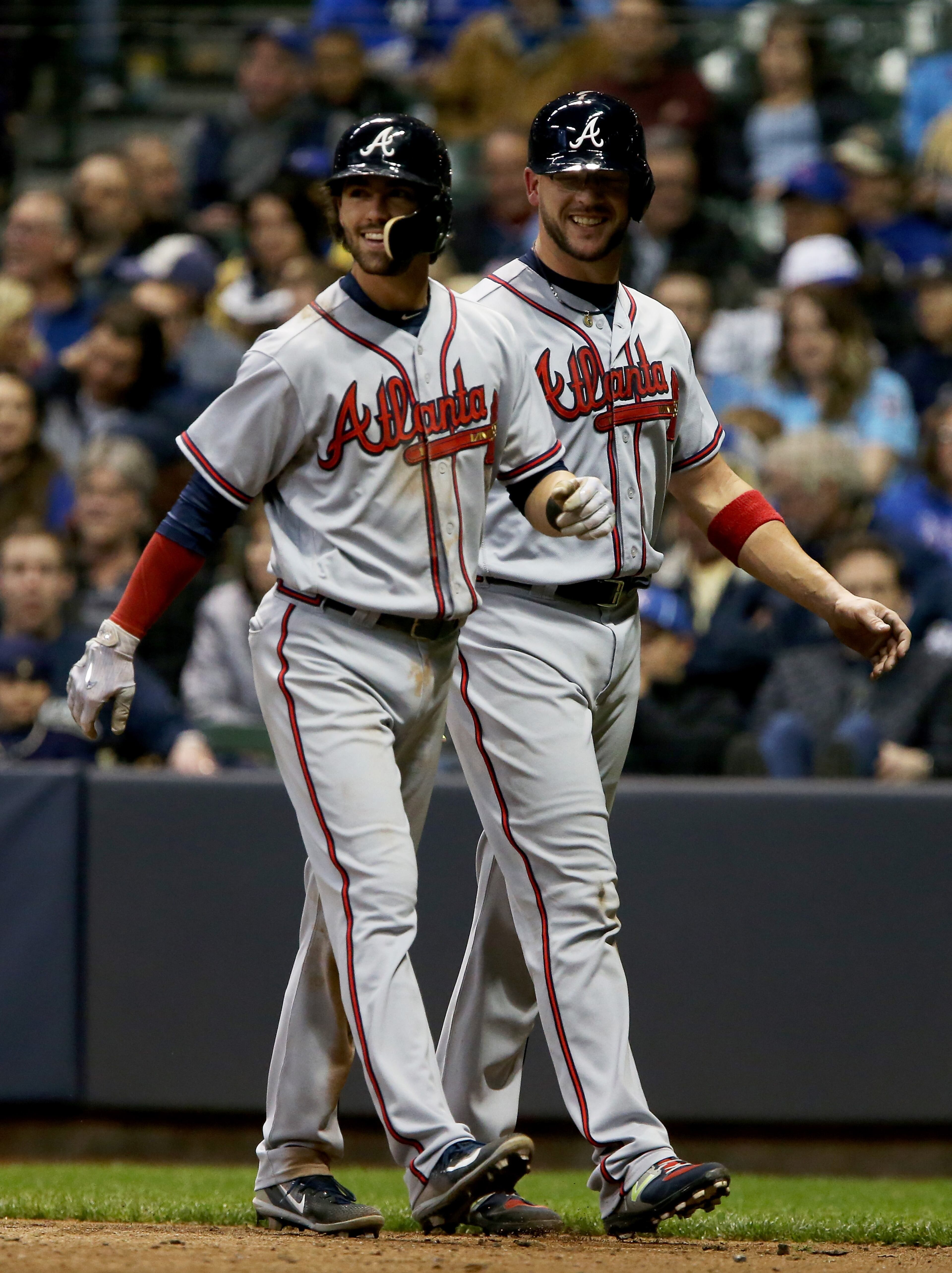 MILWAUKEE, WI - APRIL 29: Dansby Swanson #7 and Tyler Flowers #25 of the Atlanta Braves walk back to the dugout after Swanson hit a home run in the seventh inning against the Milwaukee Brewers at Miller Park on April 29, 2017 in Milwaukee, Wisconsin. (Photo by Dylan Buell/Getty Images)